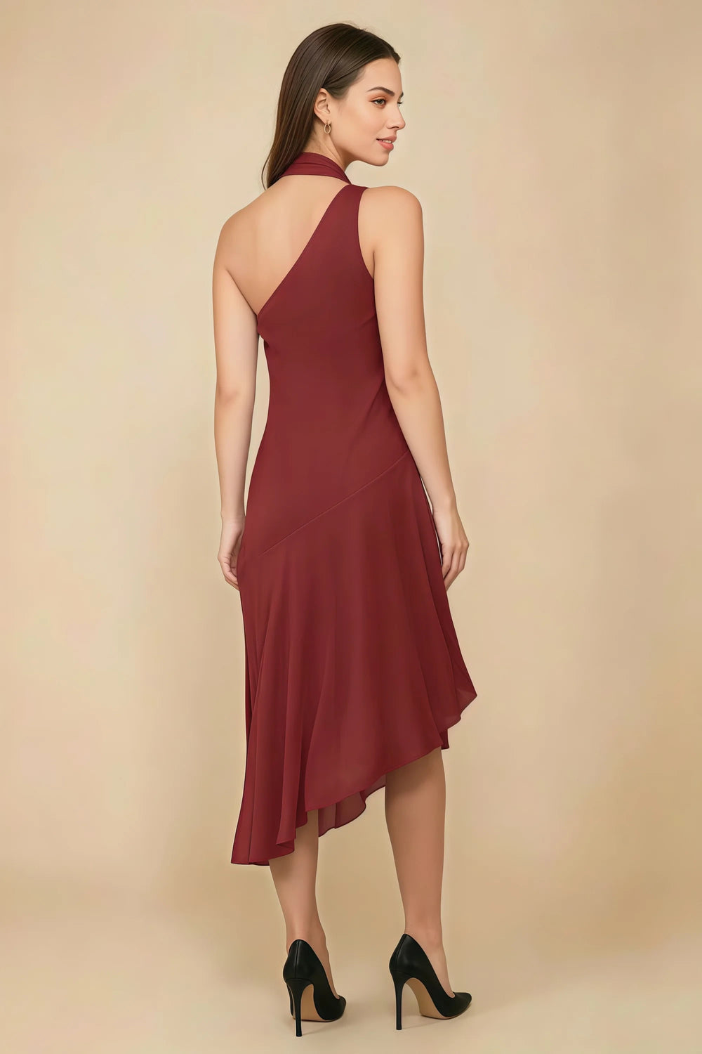 Translation missing: en.Rear three-quarter view of the LVLVS Alma rust midi dress, showing the diagonal back neckline and asymmetric midi skirt. content.product_image_secondary