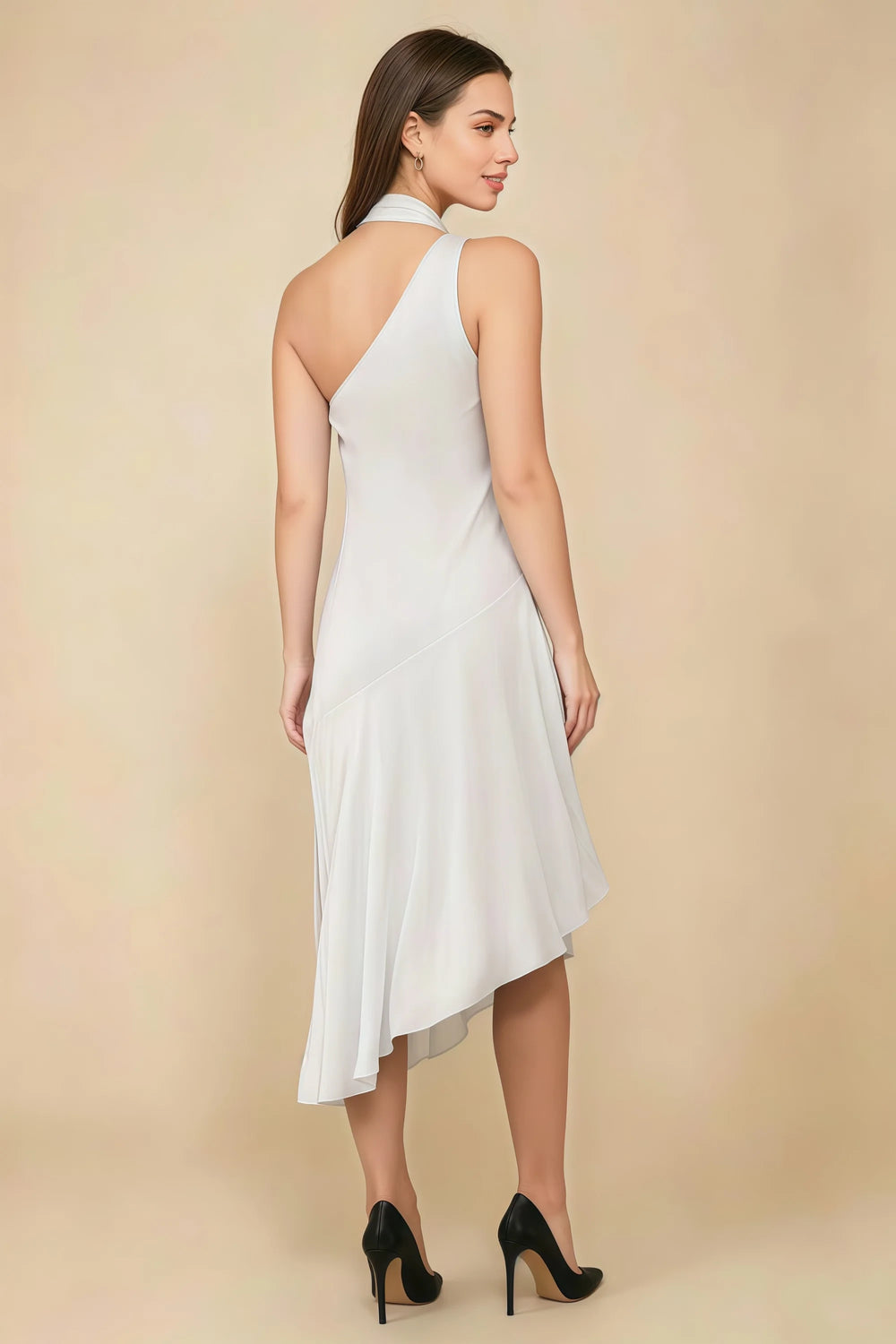 Translation missing: en.Rear three-quarter view of the LVLVS Alma white midi dress, showing the diagonal back neckline and asymmetric midi skirt. content.product_image_secondary
