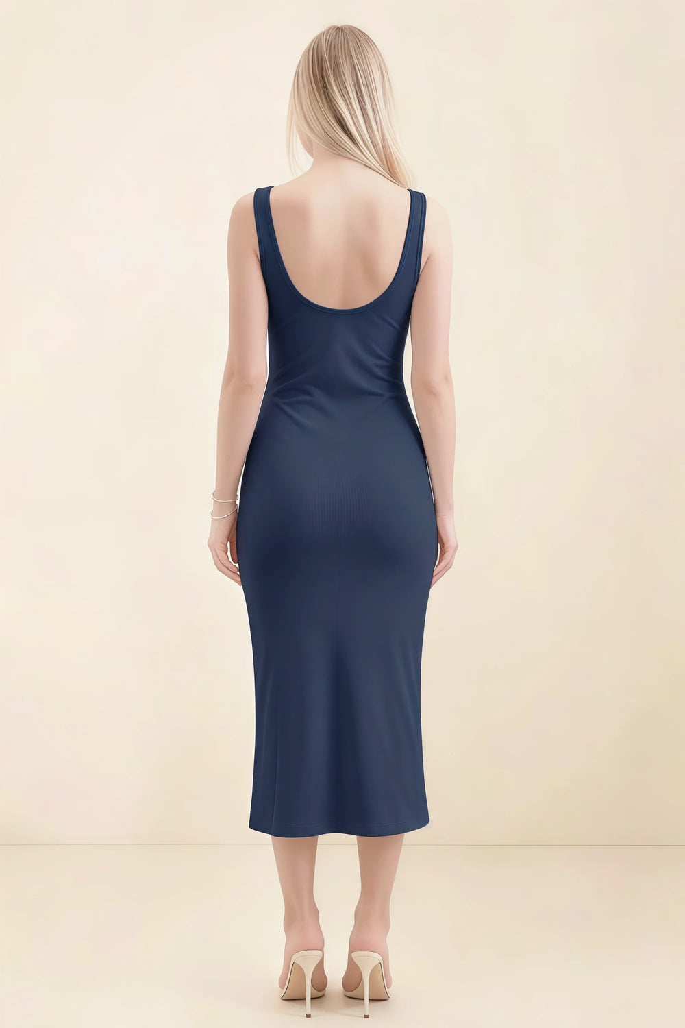 Translation missing: en.Back view of the LVLVS Alvina navy midi dress, showing the low scoop back, wide straps and fitted midi skirt. content.product_image_secondary