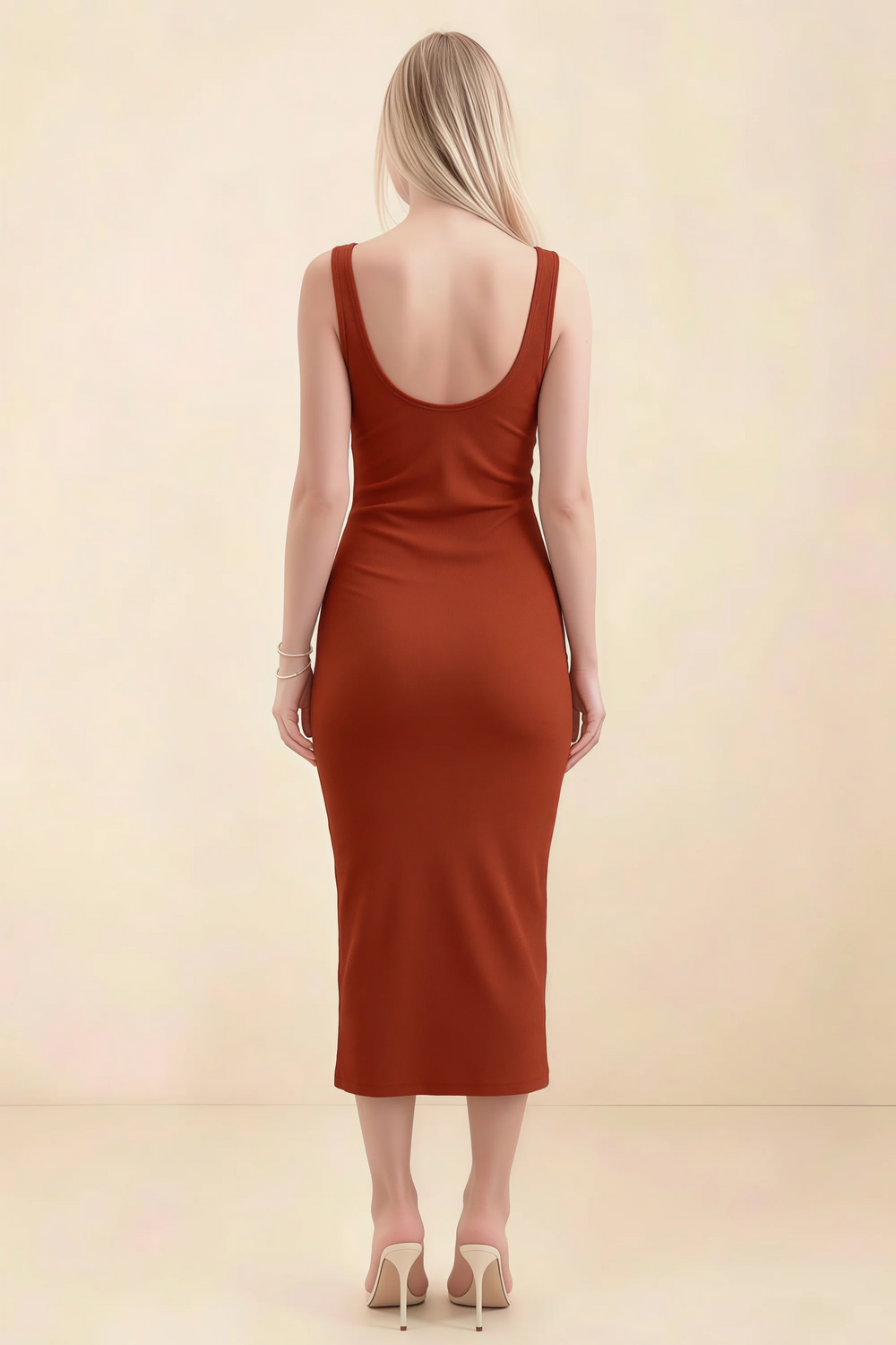 Translation missing: en.Back view of the LVLVS Alvina rust midi dress, showing the low scoop back, wide straps and fitted midi skirt. content.product_image_secondary
