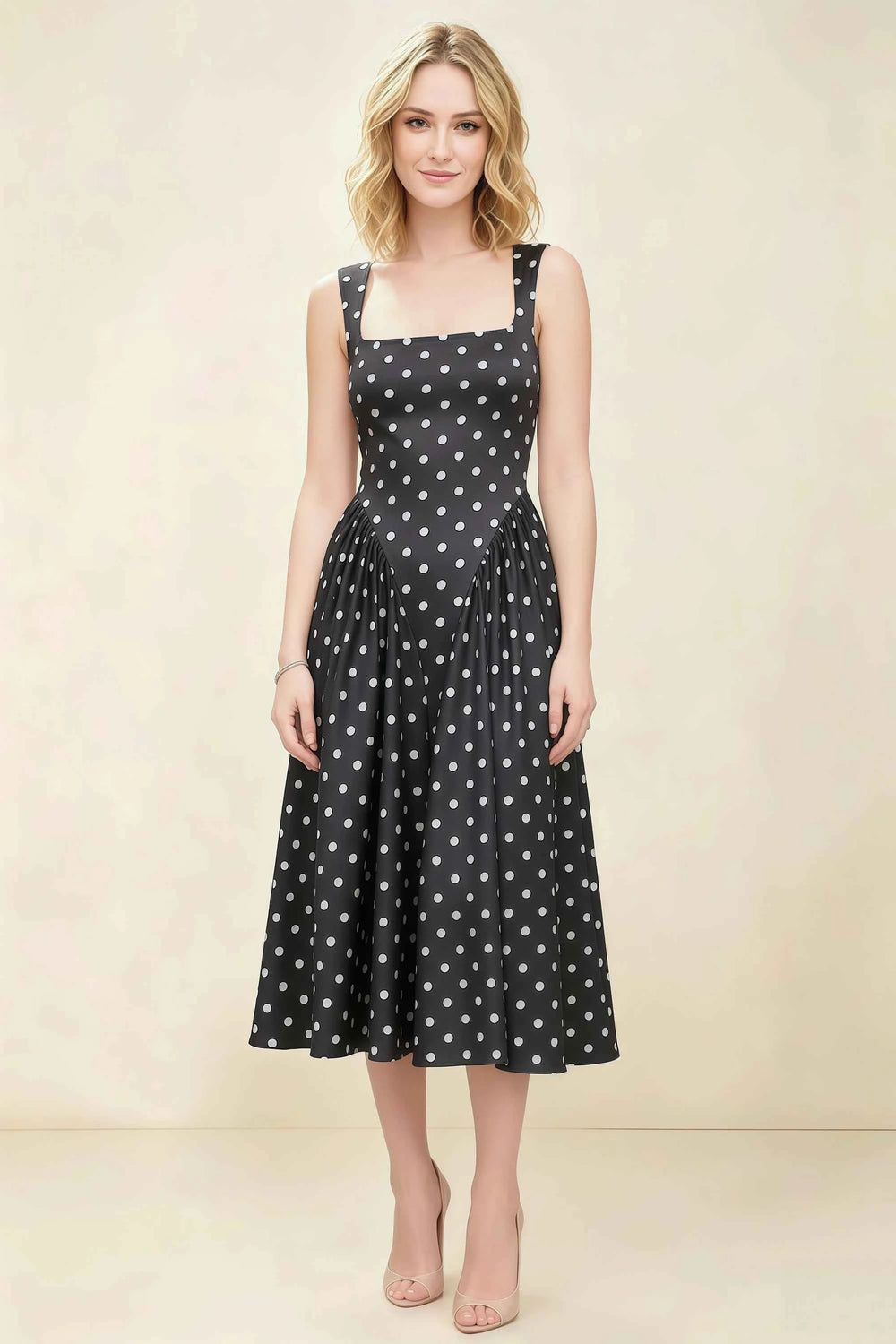 Translation missing: en.Front view of the LVLVS Anabelle black polka dot midi dress, showing the square neckline, wide shoulder straps and flared skirt. content.product_image_main