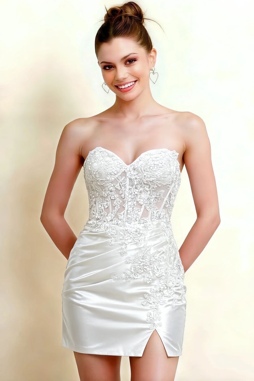 White Andrea bodycon sweetheart neck mini dress with slit, front close-up view emphasizing intricate lace appliques and sweetheart neckline, satin ruched mini skirt, studio shot perfect for cocktail party or bridal shower