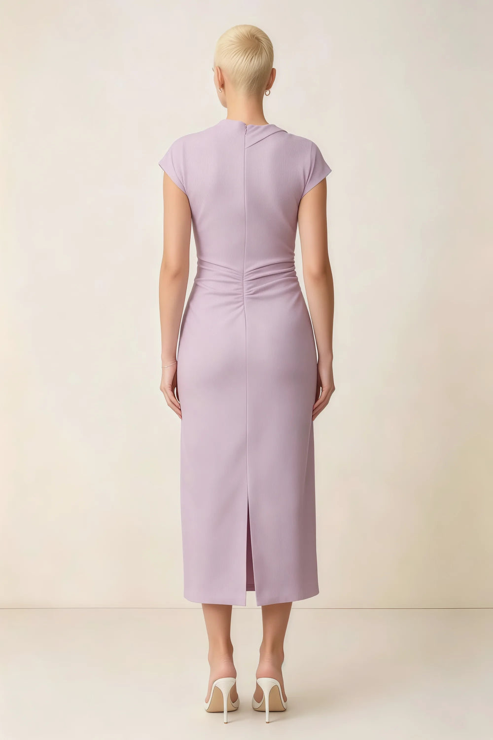 Translation missing: en.Back view of the LVLVS Anita lilac midi dress, showing the covered back, gathered waist and center skirt slit. content.product_image_secondary