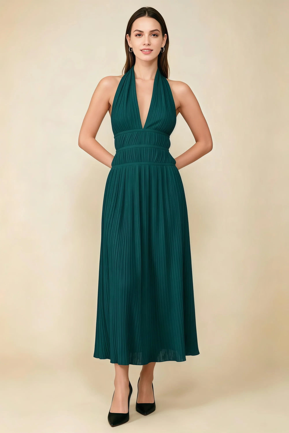Translation missing: en.Front view of the LVLVS Arabella emerald green pleated midi dress with a deep V halter neckline and defined waist. content.product_image_main
