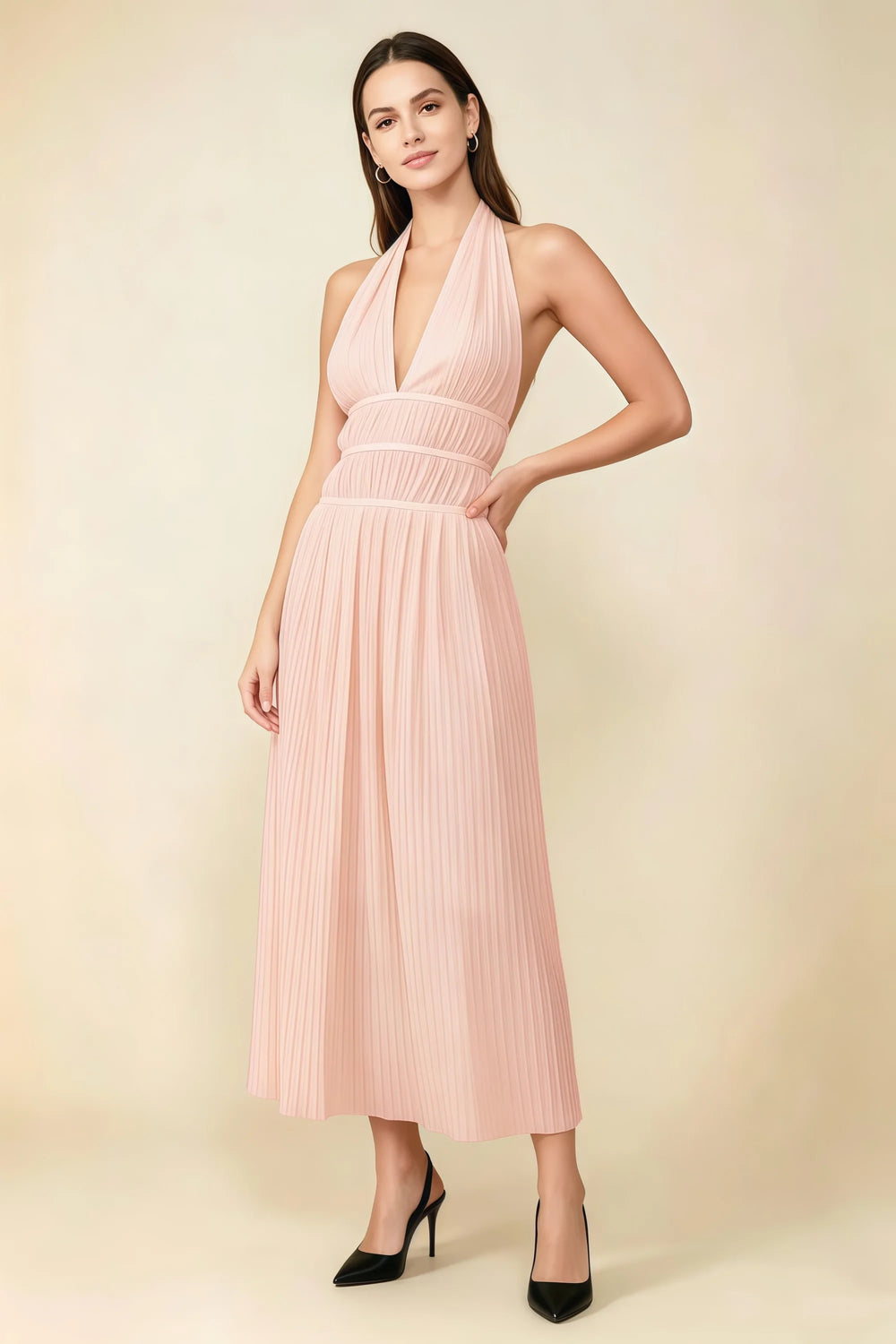 Translation missing: en.Front view of the LVLVS Arabella light pink pleated midi dress with a deep V halter neckline and defined waist. content.product_image_main