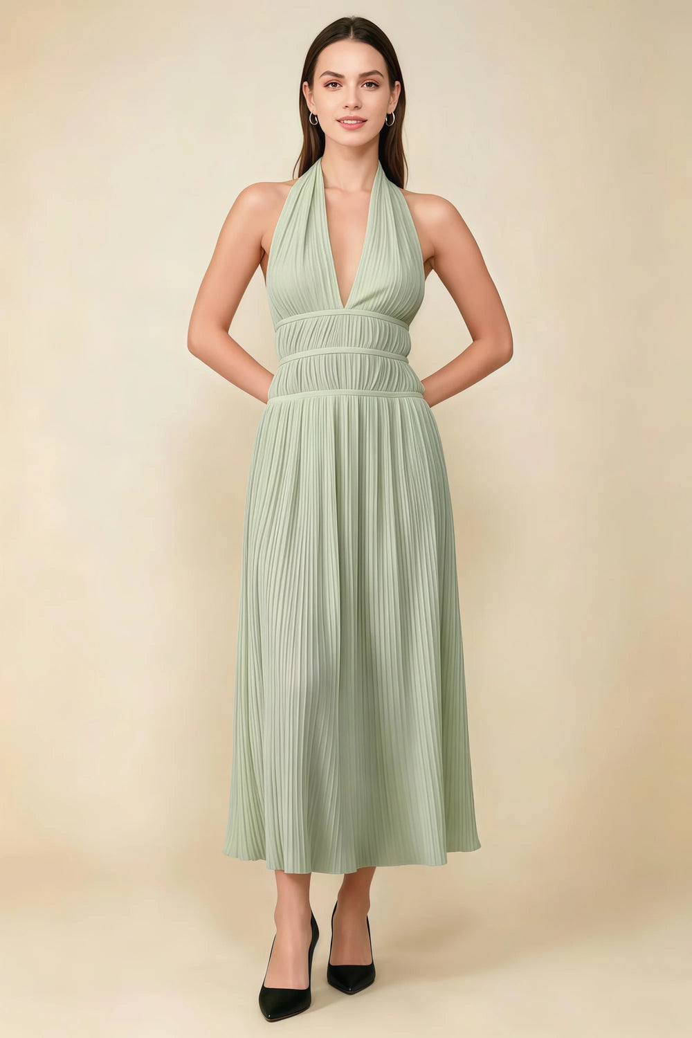 Translation missing: en.Front view of the LVLVS Arabella sage green pleated midi dress with a deep V halter neckline and defined waist. content.product_image_main