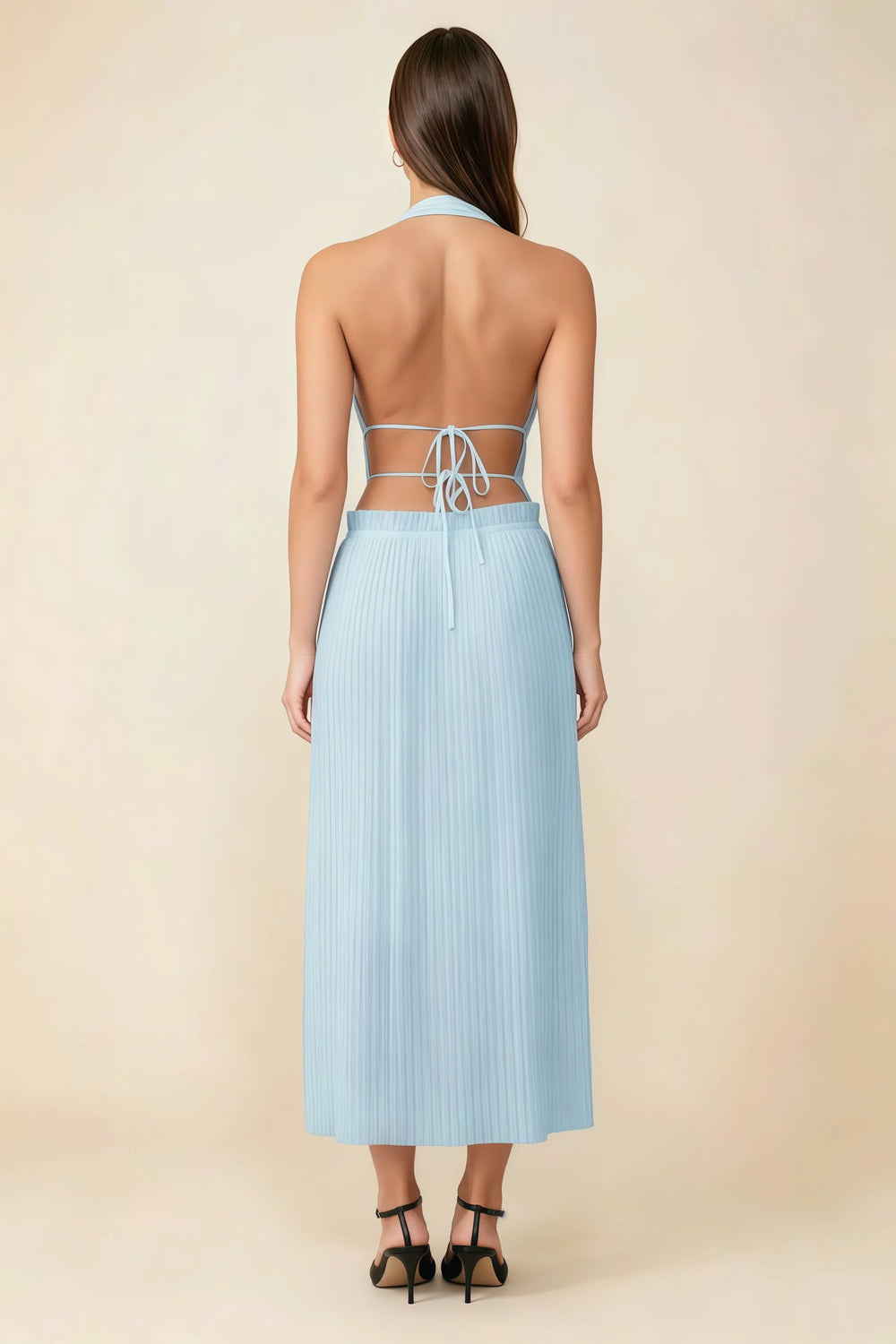 Translation missing: en.Back view of the LVLVS Arabella sky blue midi dress showing the open back, lace-up waist ties and pleated skirt. content.product_image_secondary