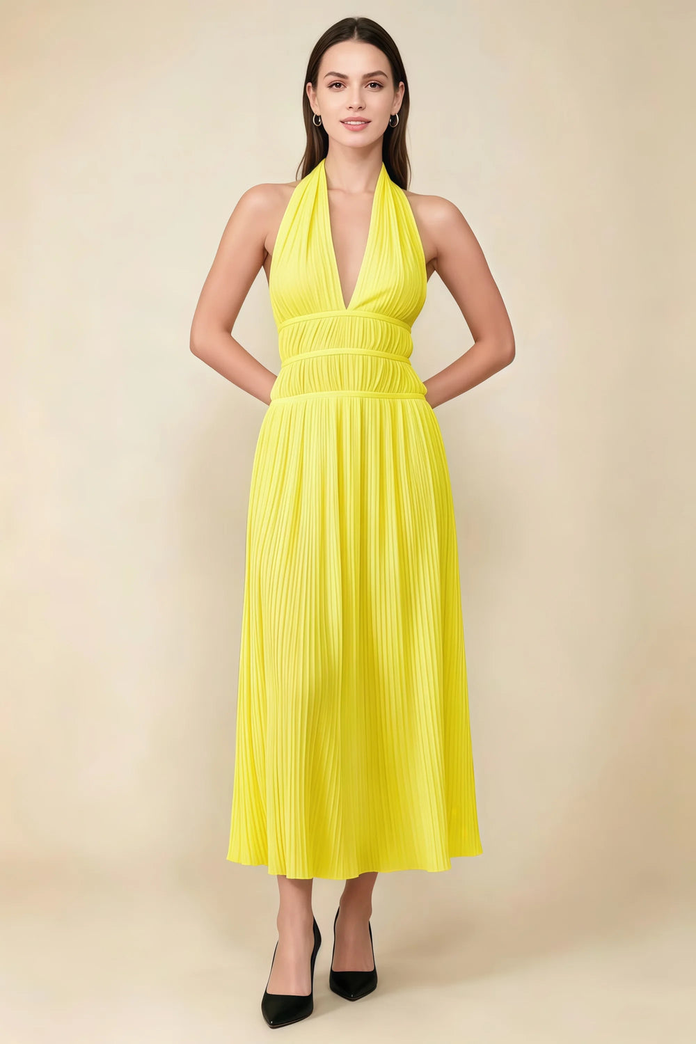 Translation missing: en.Front view of the LVLVS Arabella yellow pleated midi dress with a deep V halter neckline and defined waist. content.product_image_main