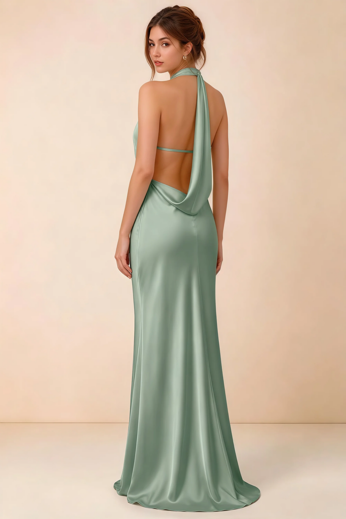 Back view of the LVLVS Astrid agave satin maxi dress, showing the low open back, slim back strap and draped cowl panel.