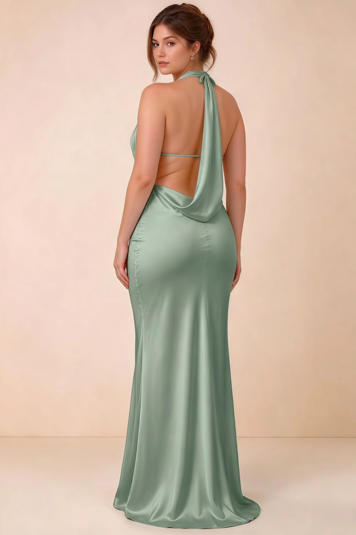 Rear three-quarter view of the LVLVS Astrid agave maxi dress, highlighting the neck ties, slim back strap and cowl draping.