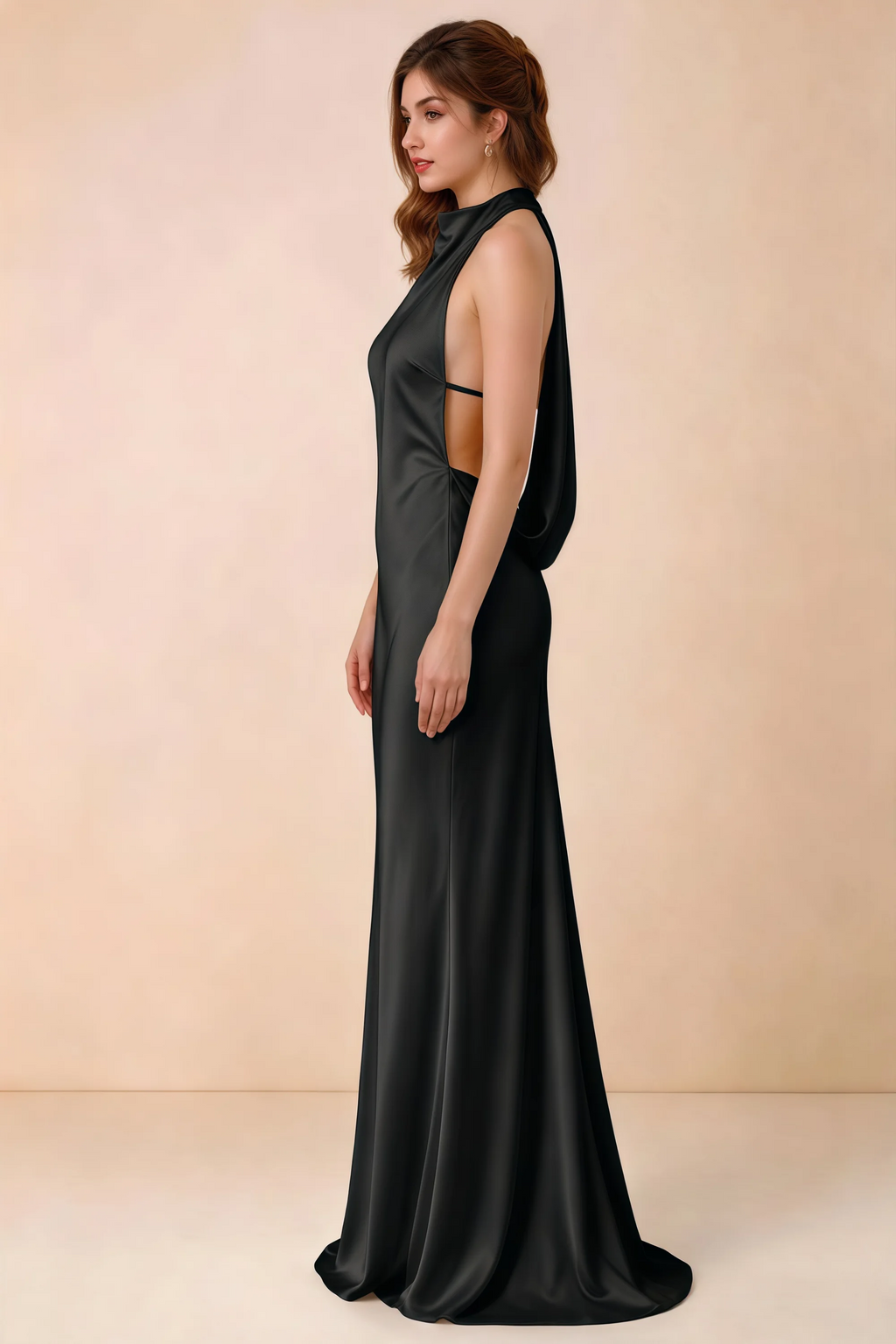 Side view of the Astrid black satin maxi dress, showing the halter neckline, open sides and softly draped back.