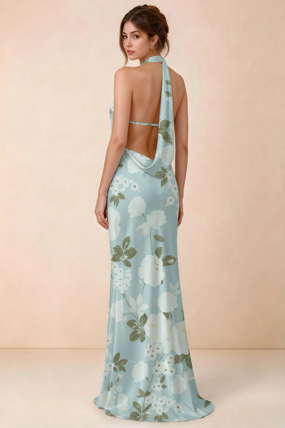 Back view of Astrid blue floral halter maxi dress, highlighting the open draped back.