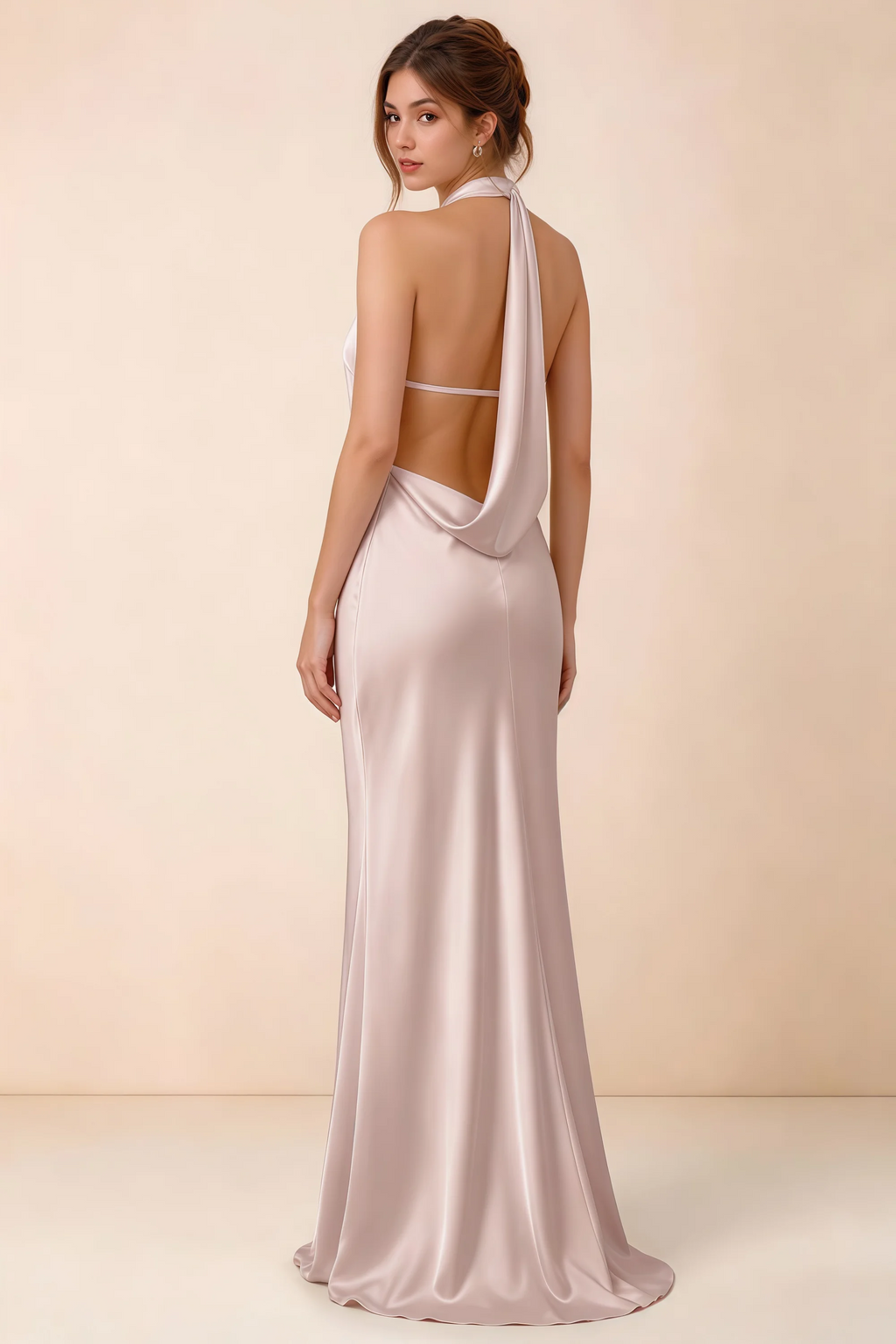 Back view of the Astrid blush satin maxi dress, showing the low open back, slim horizontal strap and draped cowl panel.