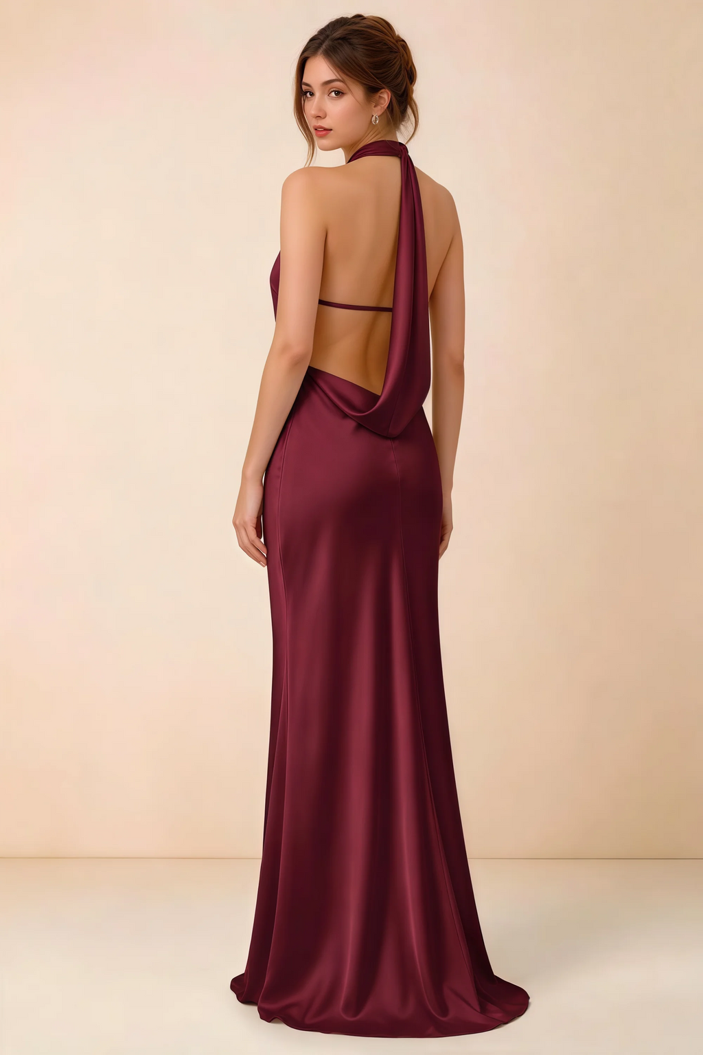 Back view of the Astrid burgundy satin maxi dress, showing the low open back, slim horizontal strap and draped cowl panel.
