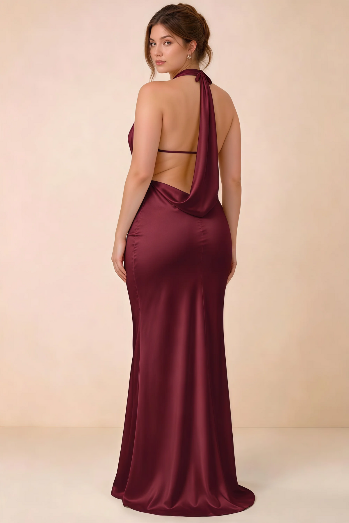 Rear three-quarter view of the Astrid burgundy satin maxi dress, showing the halter ties, slim back strap and cowl detail.