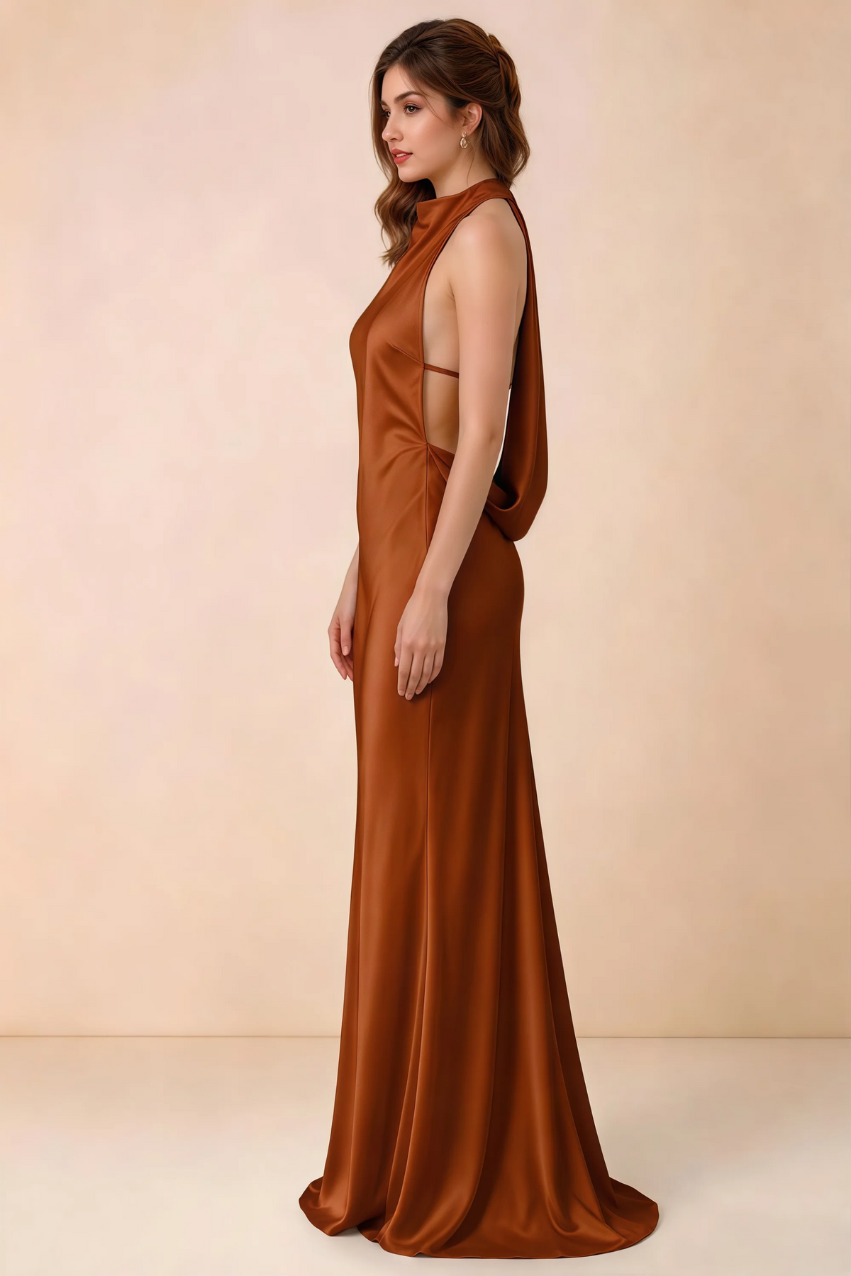 Side view of the Astrid burnt orange satin maxi dress, showing the halter neckline, open sides and softly draped back.