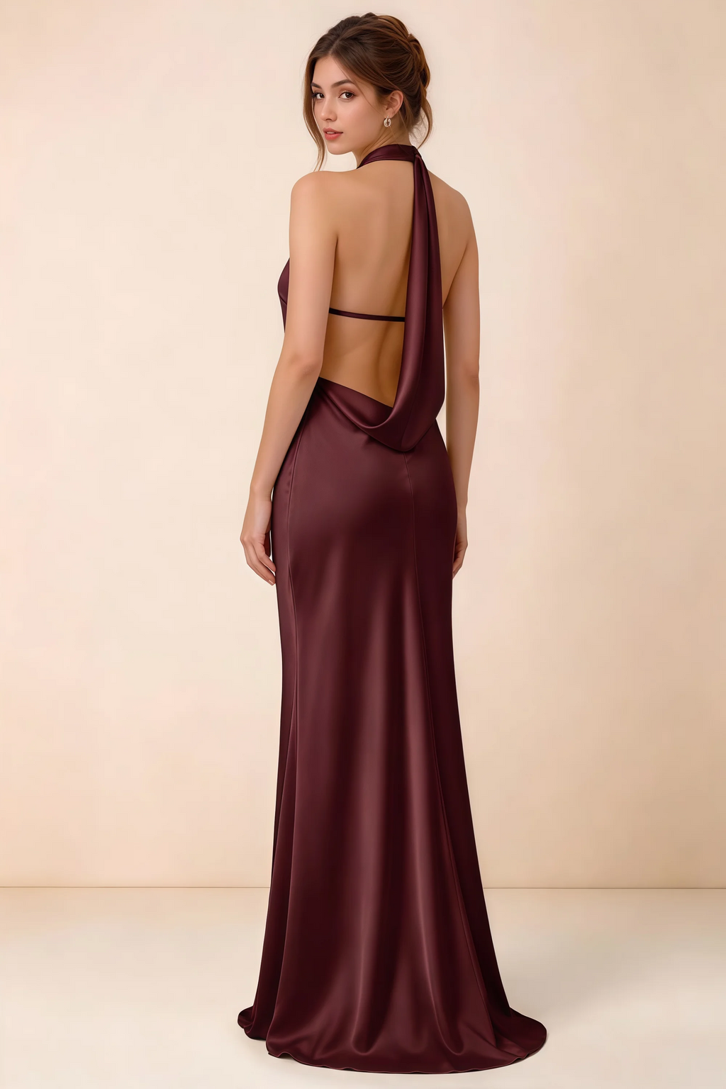 Back view of the Astrid cabernet satin maxi dress, showing the low open back, slim horizontal strap and draped cowl panel.