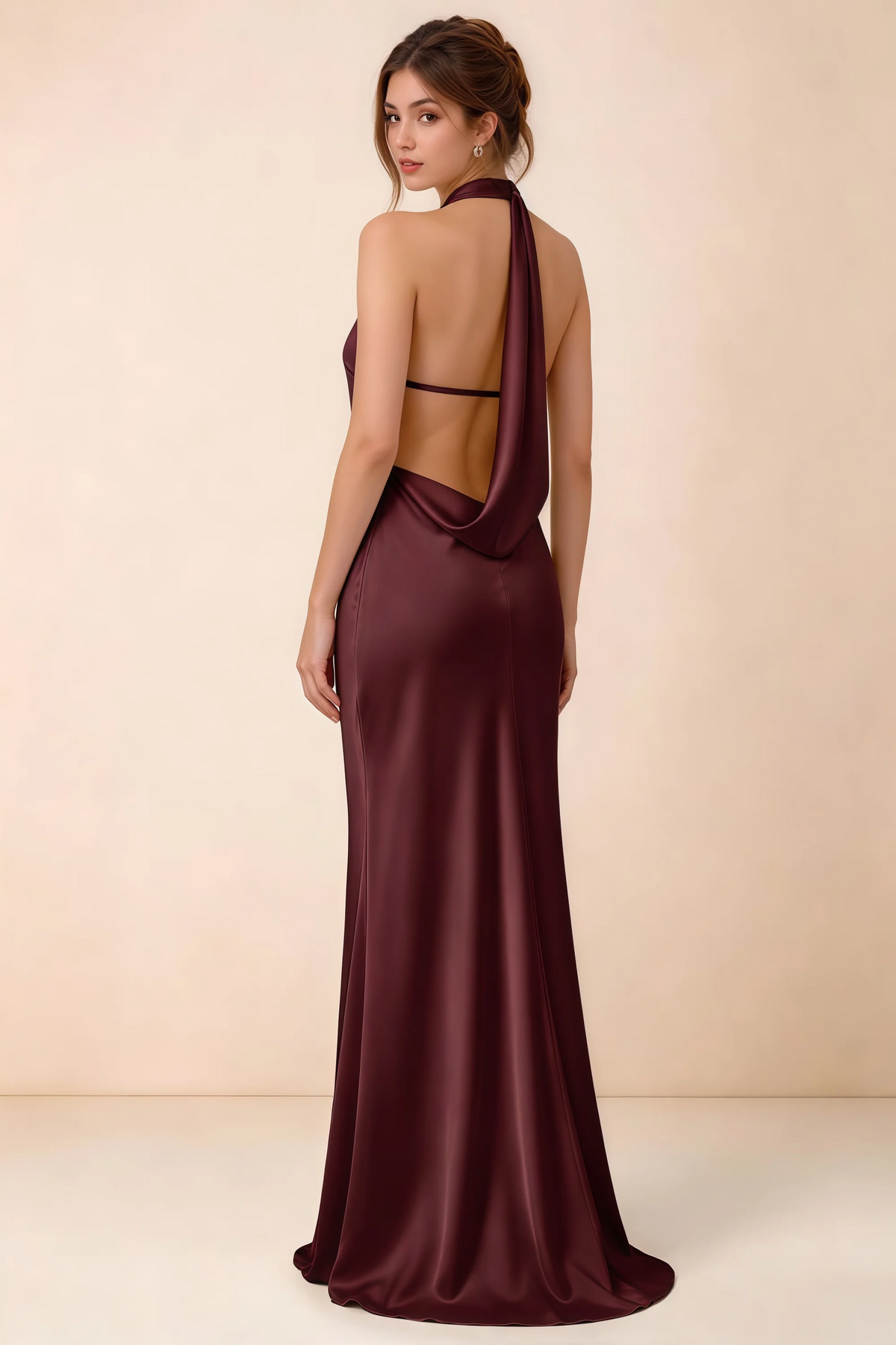 Back view of the Astrid cabernet satin maxi dress, showing the low open back, slim horizontal strap and draped cowl panel.