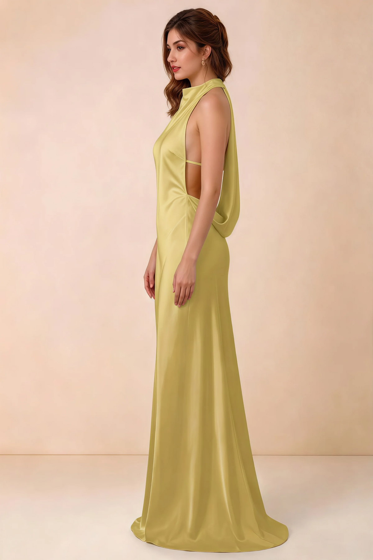 Side view of the Astrid canary satin maxi dress, showing the halter neckline, open sides and softly draped back.