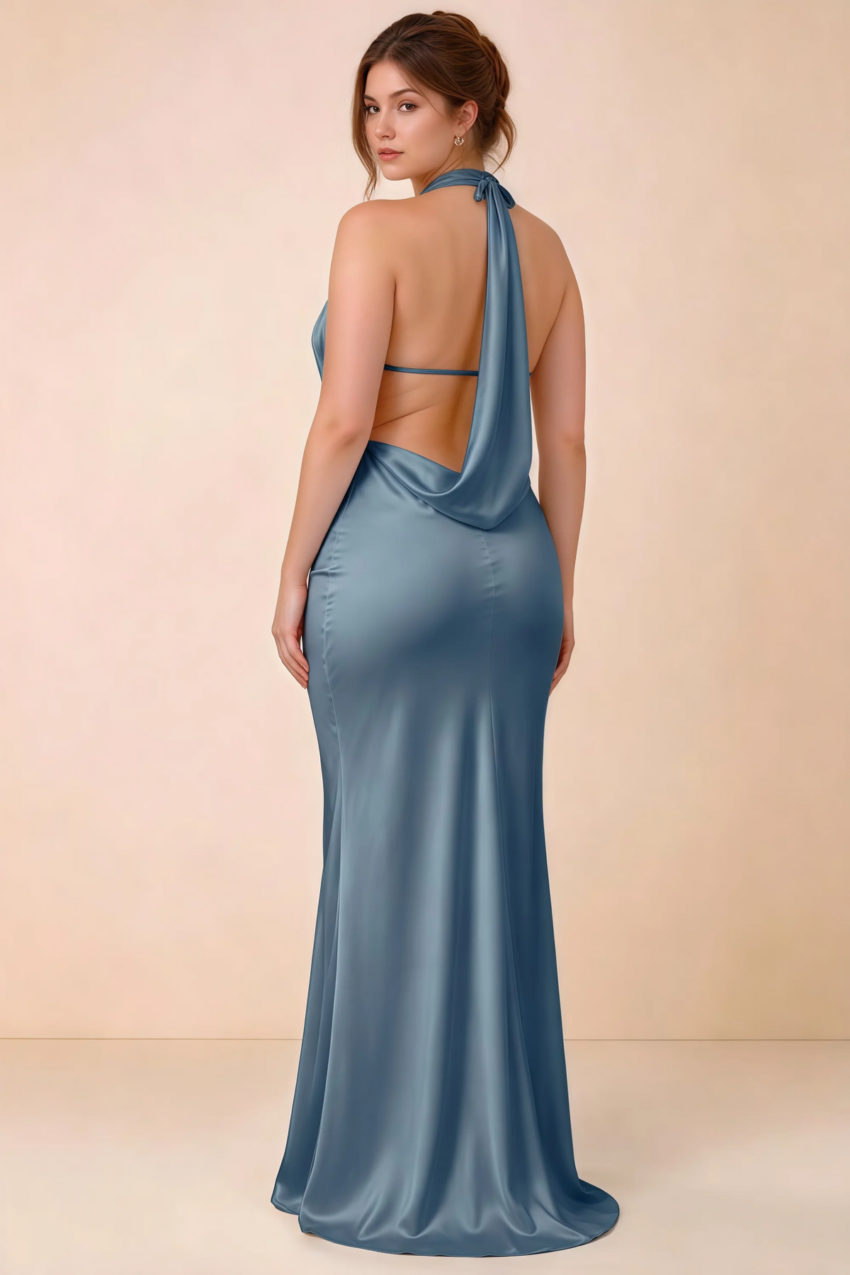 Three-quarter rear view of Astrid dusty blue satin halter maxi dress, showing the cowl back.