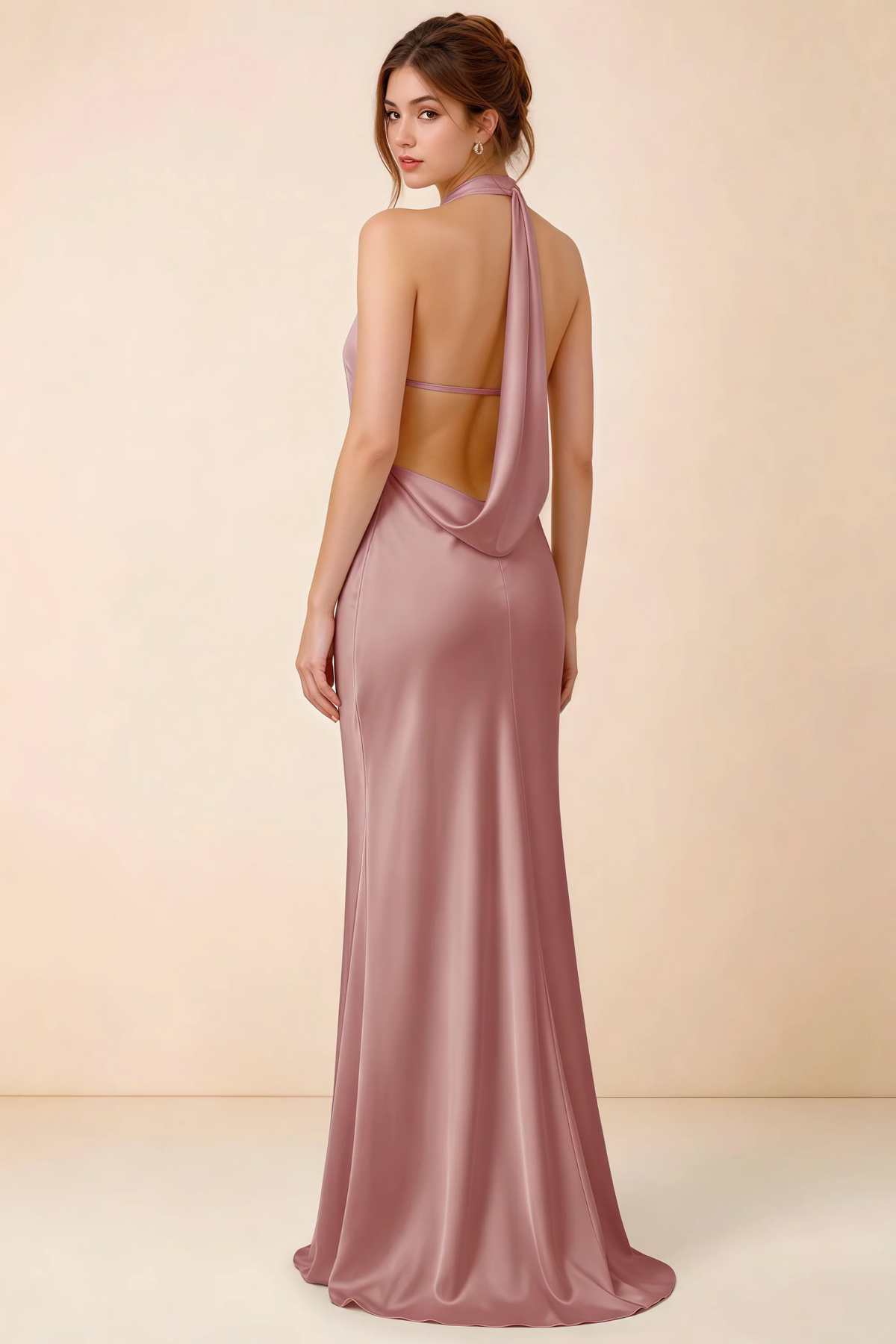 Back view of Astrid dusty rose satin halter maxi dress, highlighting the open draped back.