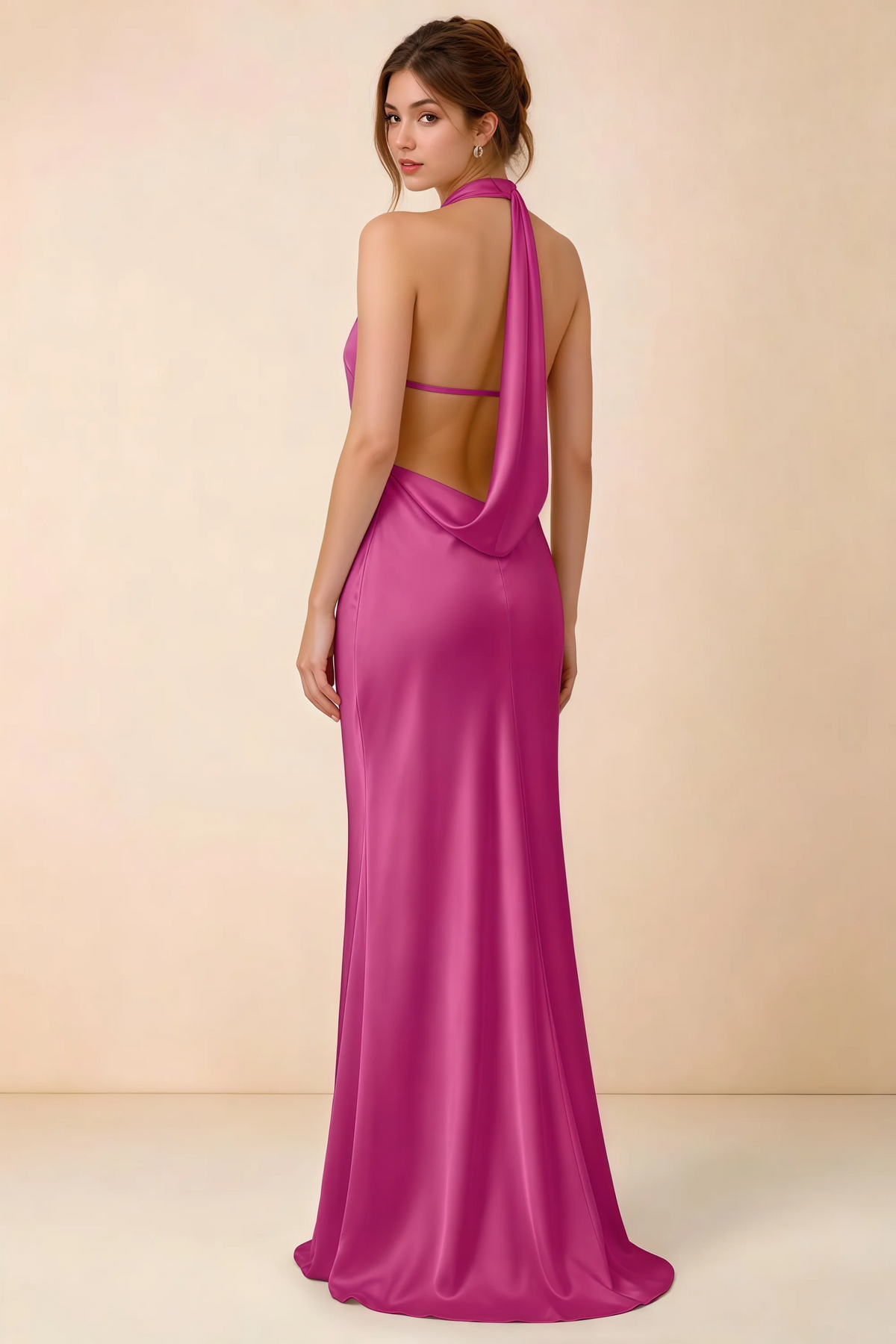 Back view of Astrid fuchsia satin halter maxi dress, highlighting the open draped back.