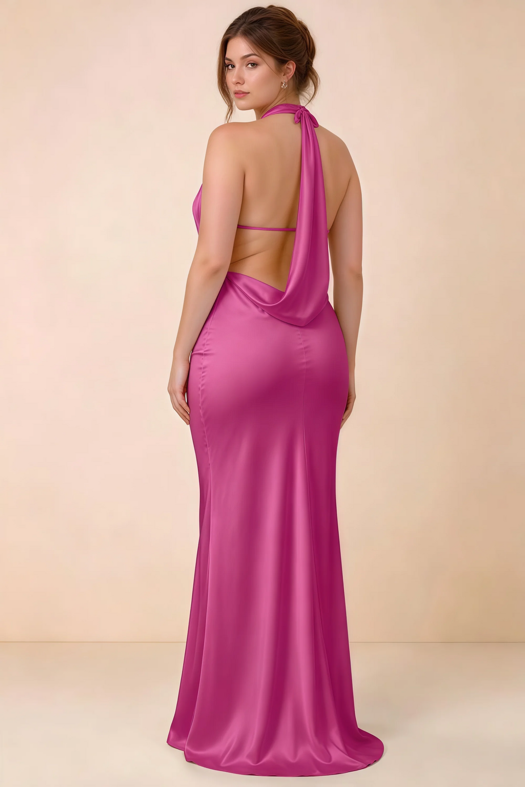 Three-quarter rear view of Astrid fuchsia satin halter maxi dress, showing the cowl back.