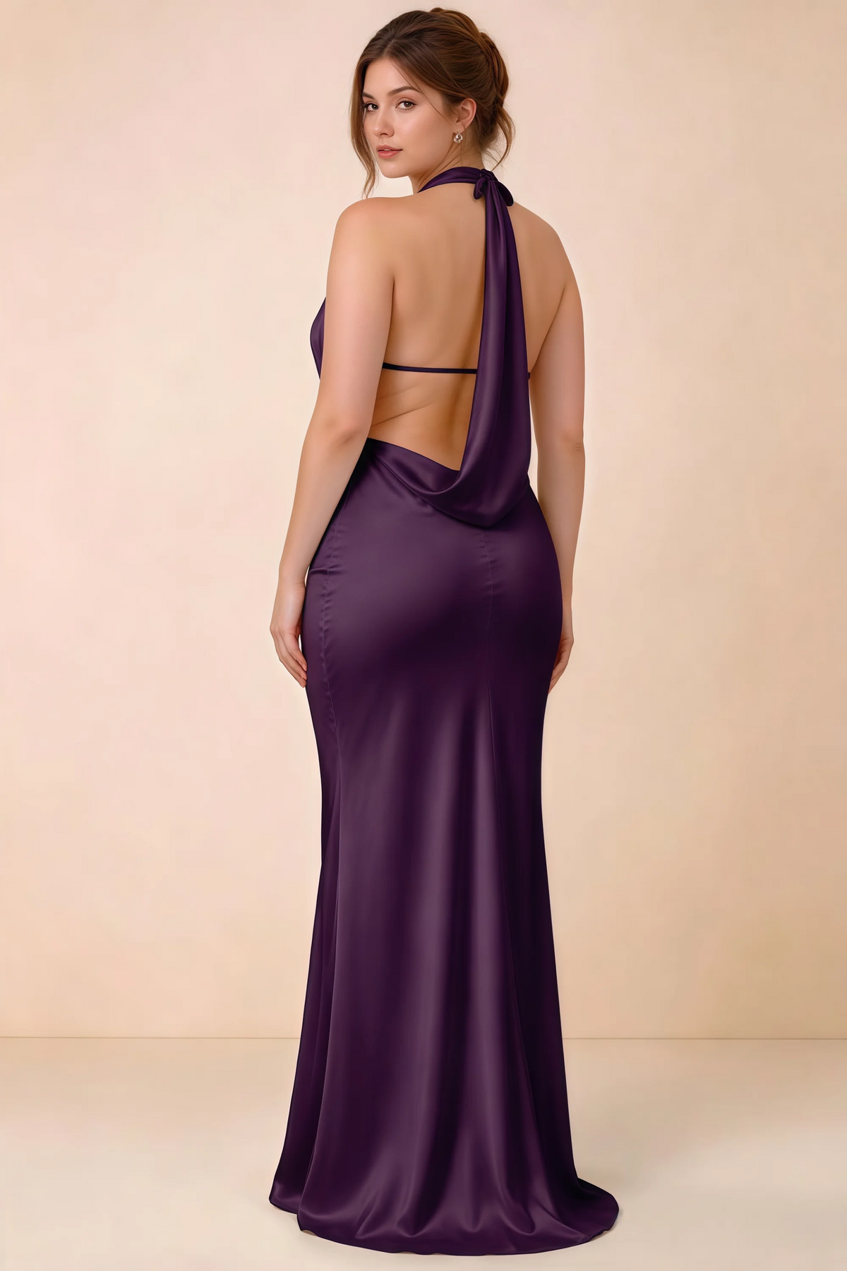 Rear three-quarter view of Astrid grape satin halter maxi dress, highlighting the open back.