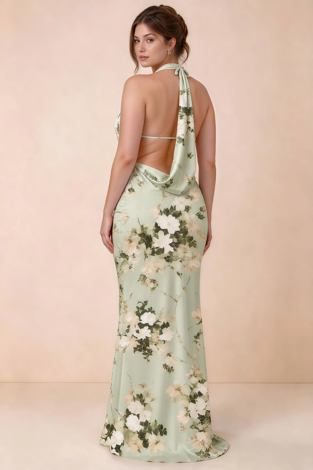 Three-quarter rear view of Astrid green floral halter maxi dress, highlighting the cowl back.