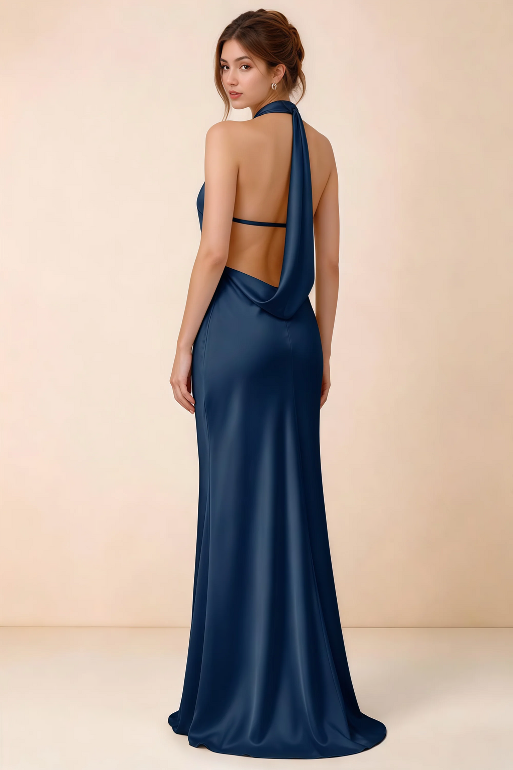 Back view of Astrid navy satin halter maxi dress, highlighting the draped open back.