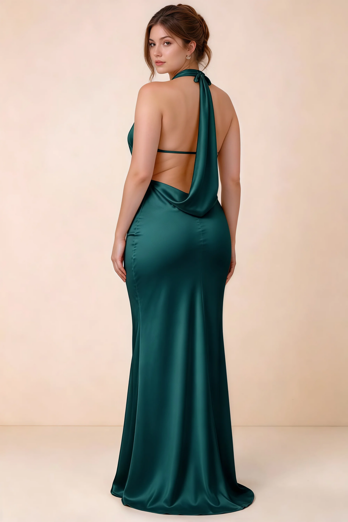 Three-quarter rear view of Astrid peacock satin halter maxi dress, highlighting the cowl back.