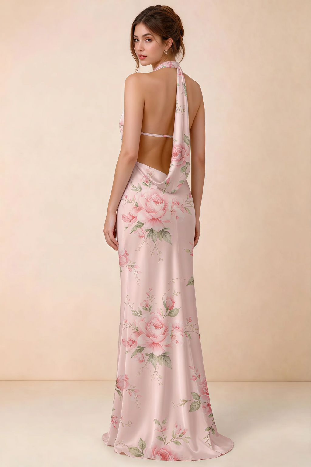 Back view of Astrid pink floral halter maxi dress, highlighting the open draped back.