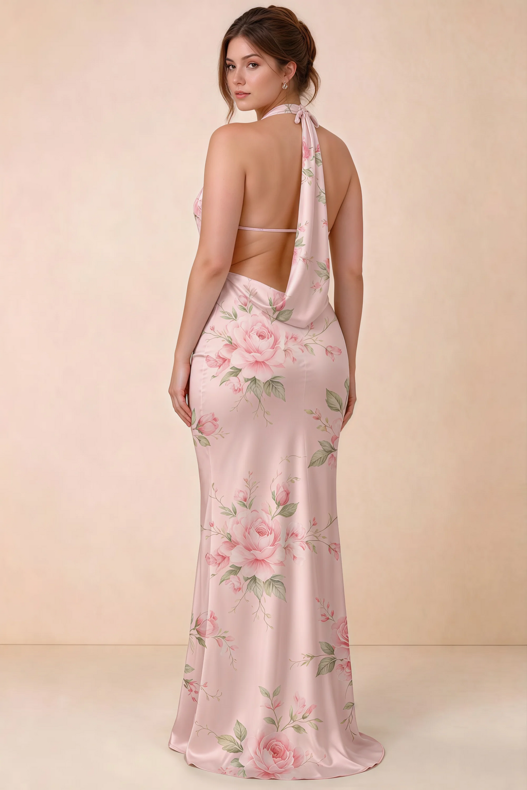 Three-quarter rear view of Astrid pink floral halter maxi dress, highlighting the cowl back.