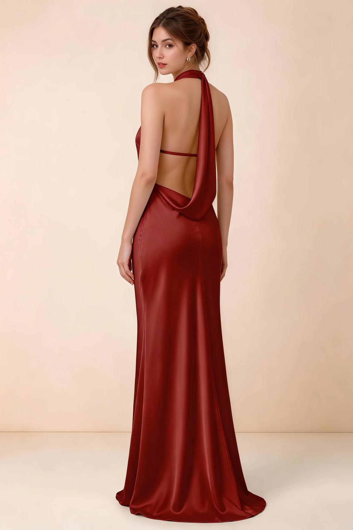Back view of Astrid pomegranate satin halter maxi dress, highlighting the draped open back.
