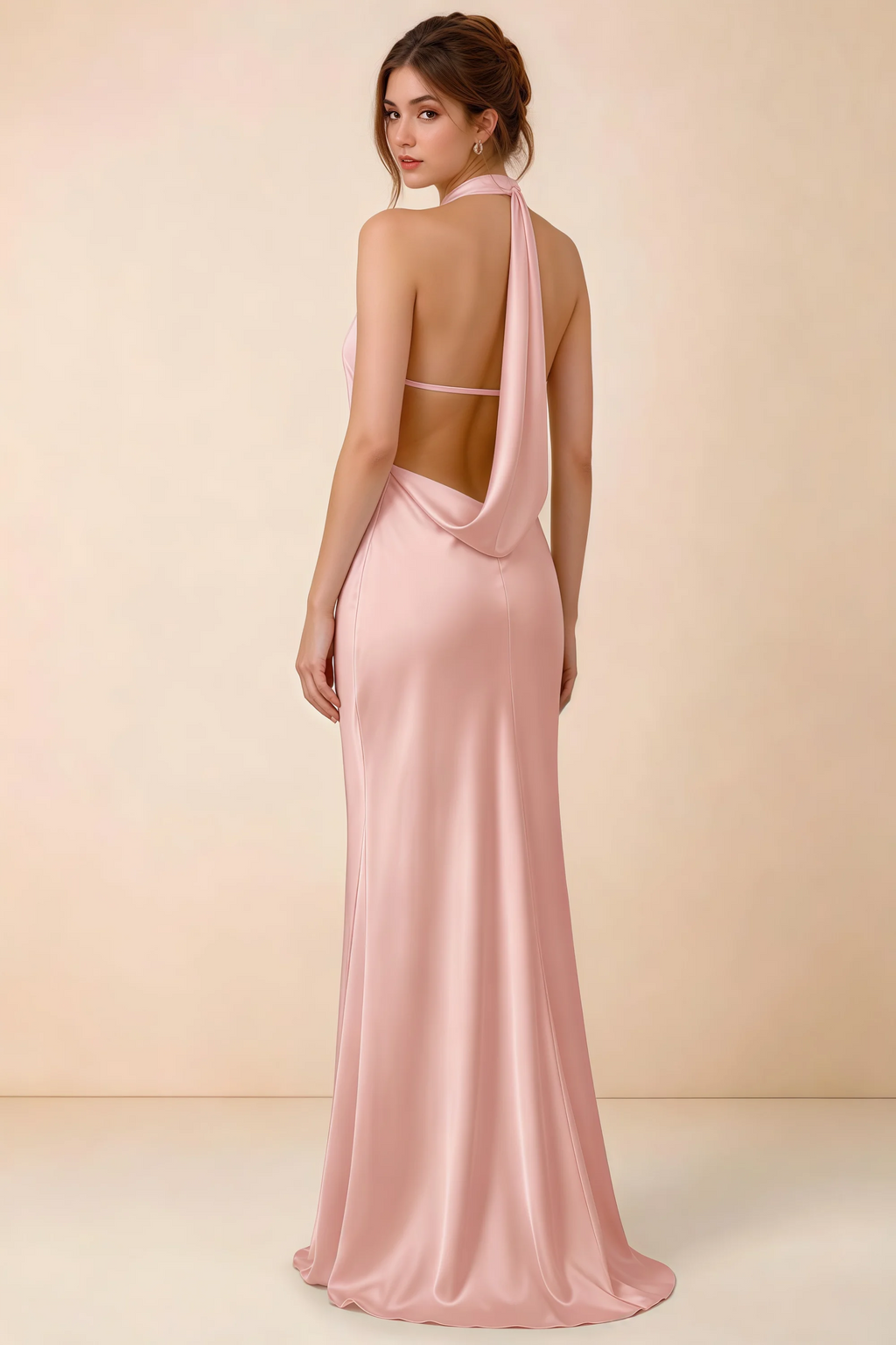 Back view of Astrid powder pink satin halter maxi dress, highlighting the draped open back.