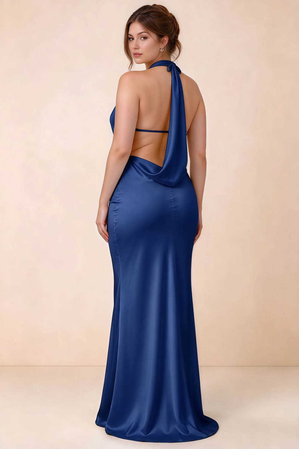 Rear three-quarter view of Astrid royal blue satin halter maxi dress, highlighting the open back.