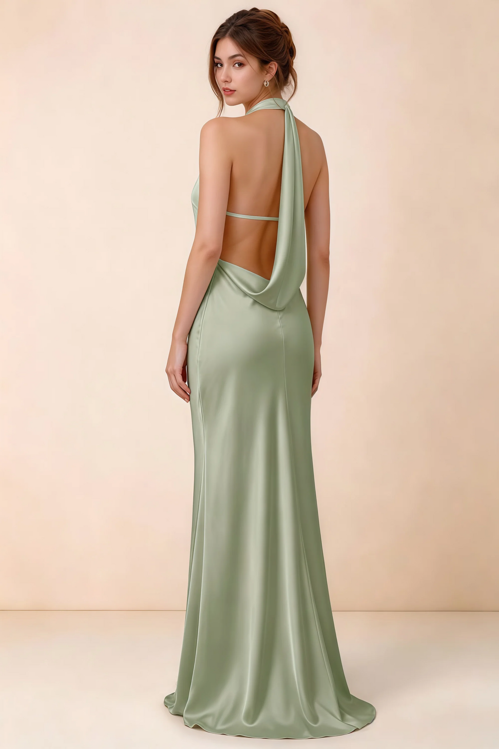 Back view of Astrid sage green satin halter maxi dress, highlighting the draped open back.