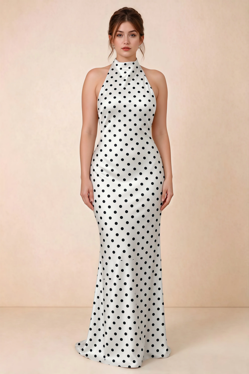 Full-length front view of Astrid white polka dot halter maxi dress, showing the flowing skirt.