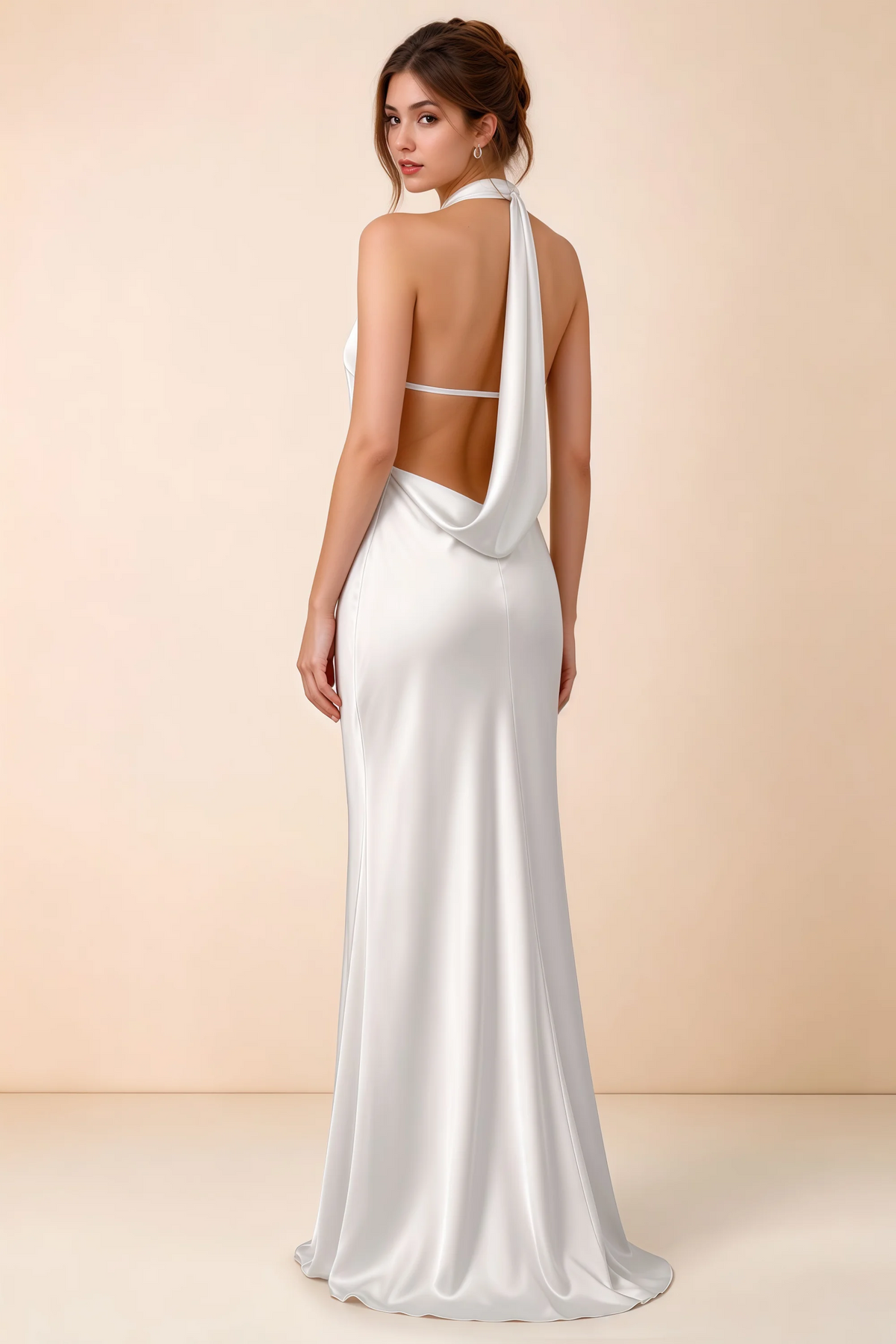 Back view of Astrid white satin halter maxi dress, highlighting the draped open back.