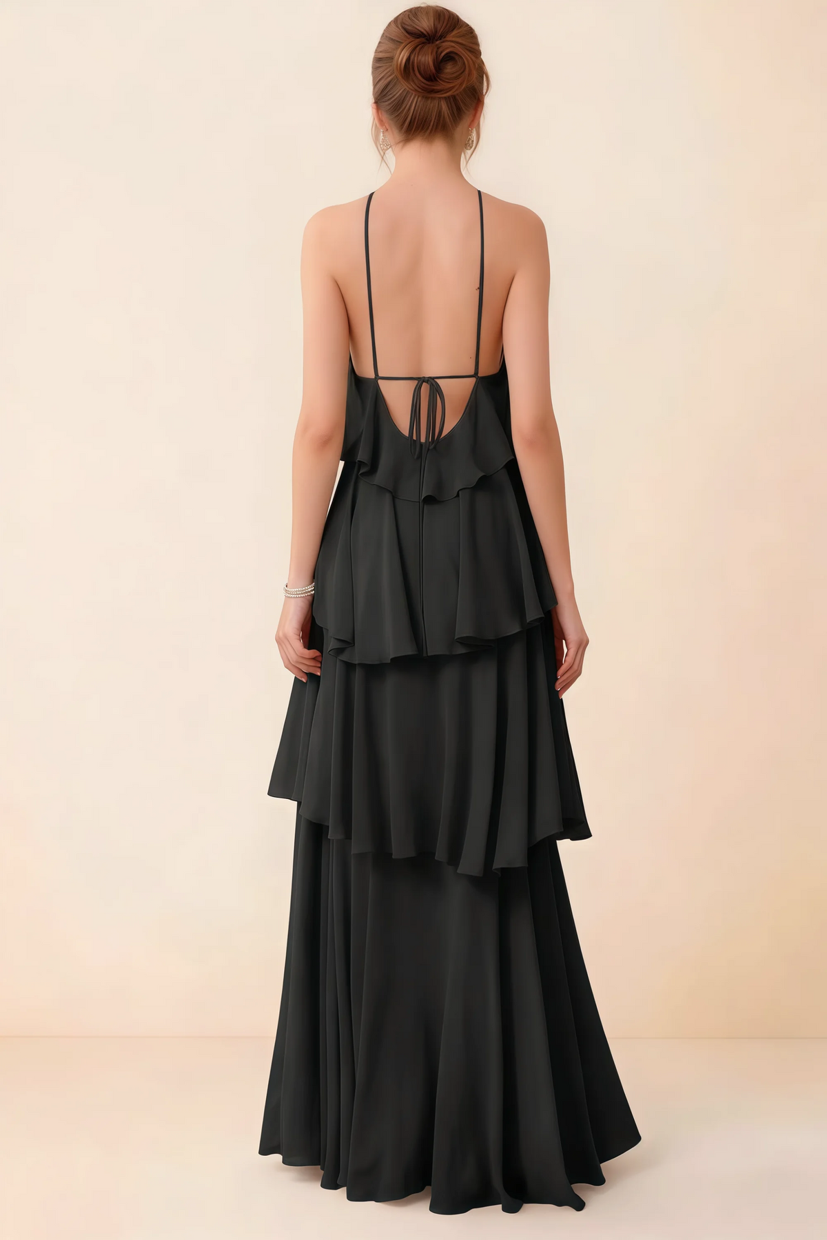 Back view of Audrey black ruffle maxi dress showing a low open back and fine tie straps