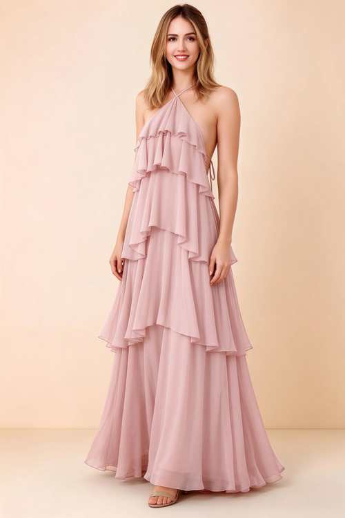 Front view of Audrey blush chiffon maxi dress with crossed halter straps and cascading tiered ruffles