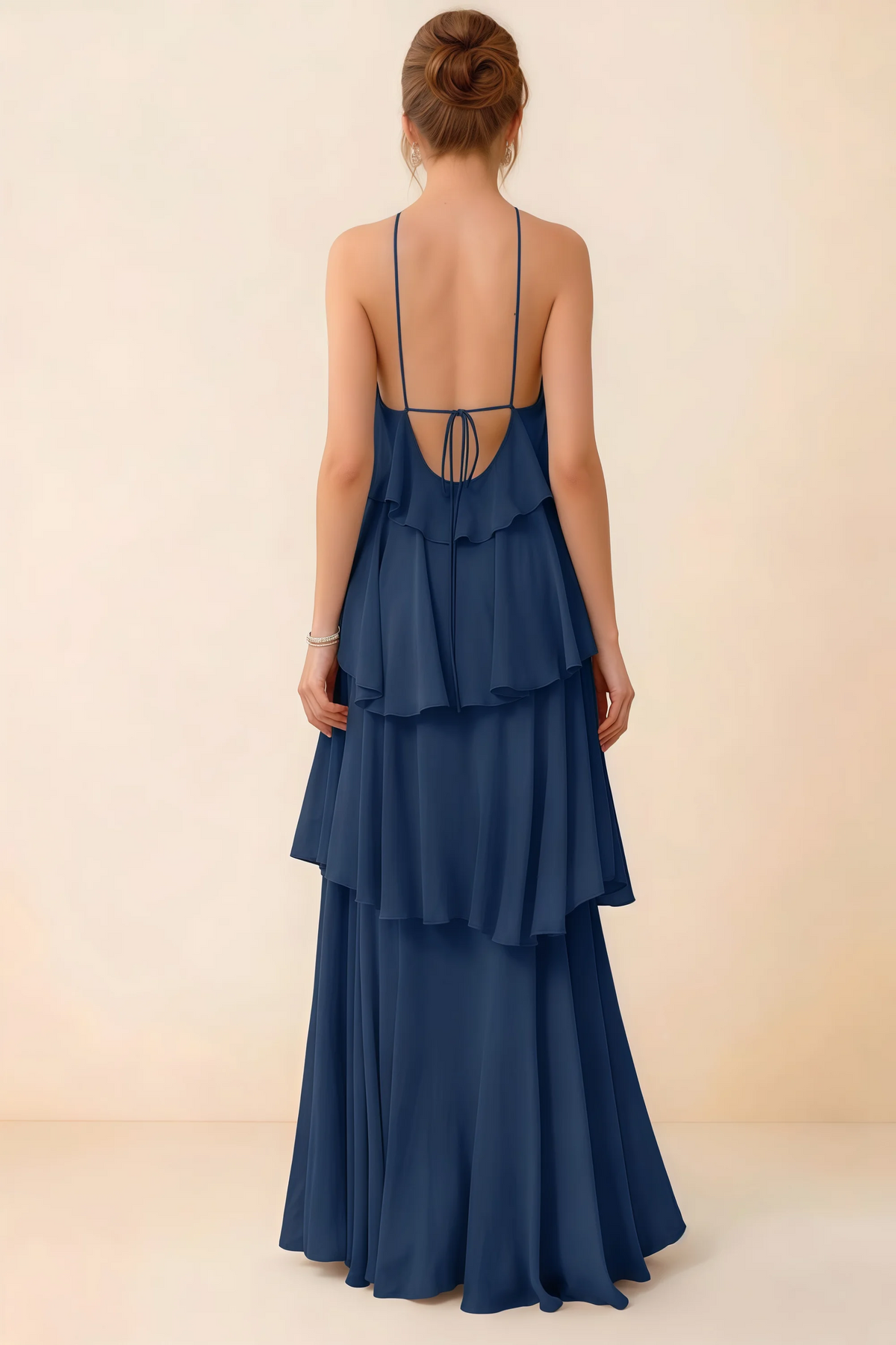 Back view of Audrey navy ruffle maxi dress showing a low open back and fine tie straps
