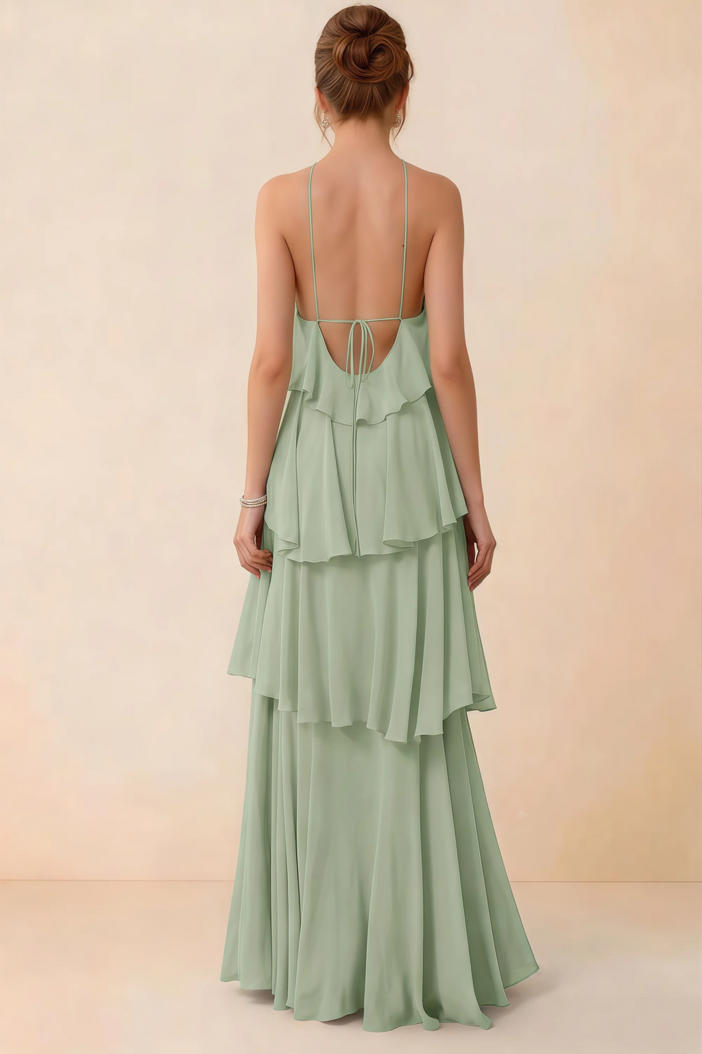 Back view of Audrey sage green ruffle maxi dress showing a low open back and fine tie straps