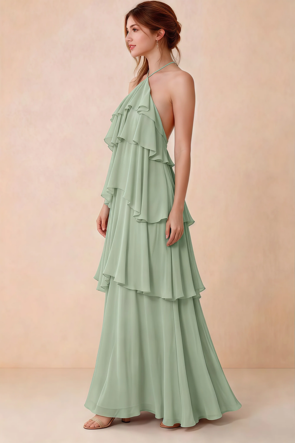 Side view of Audrey sage green chiffon dress showing the relaxed shape and layered ruffles