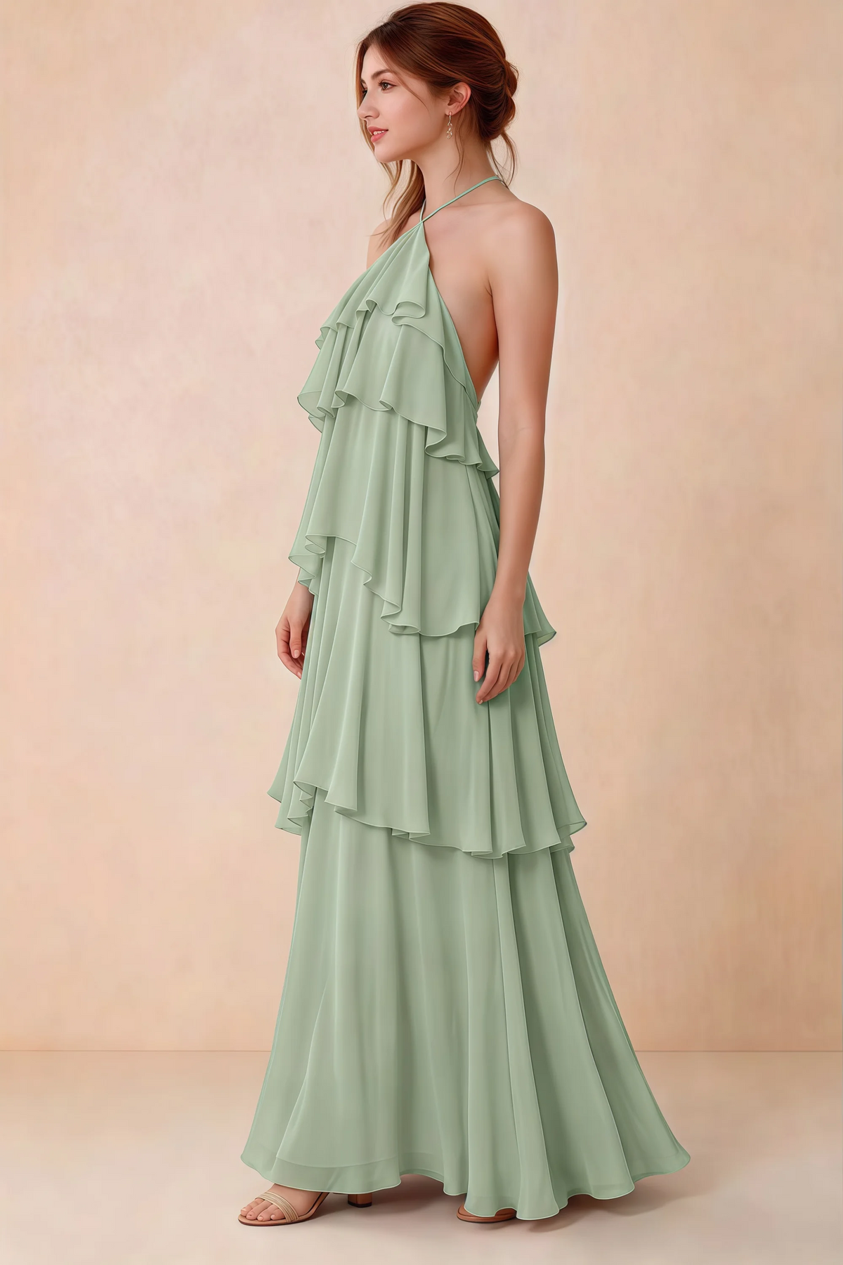 Side view of Audrey sage green chiffon dress showing the relaxed shape and layered ruffles