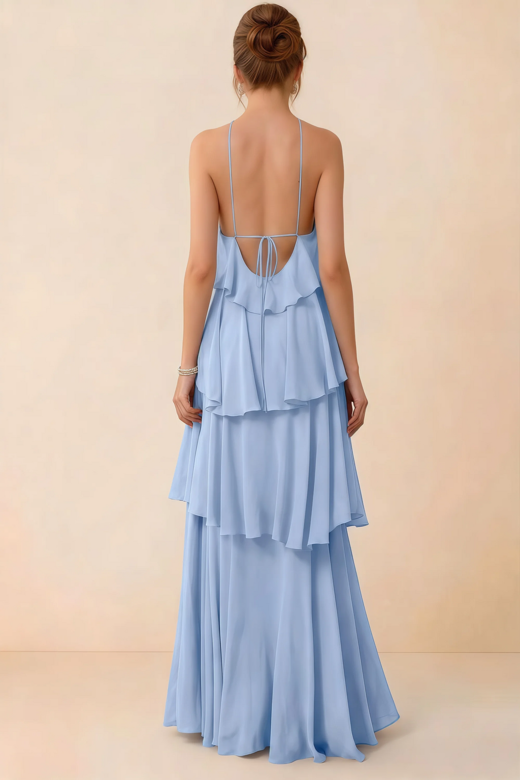 Back view of Audrey ice blue ruffle maxi dress showing a low open back and fine tie straps