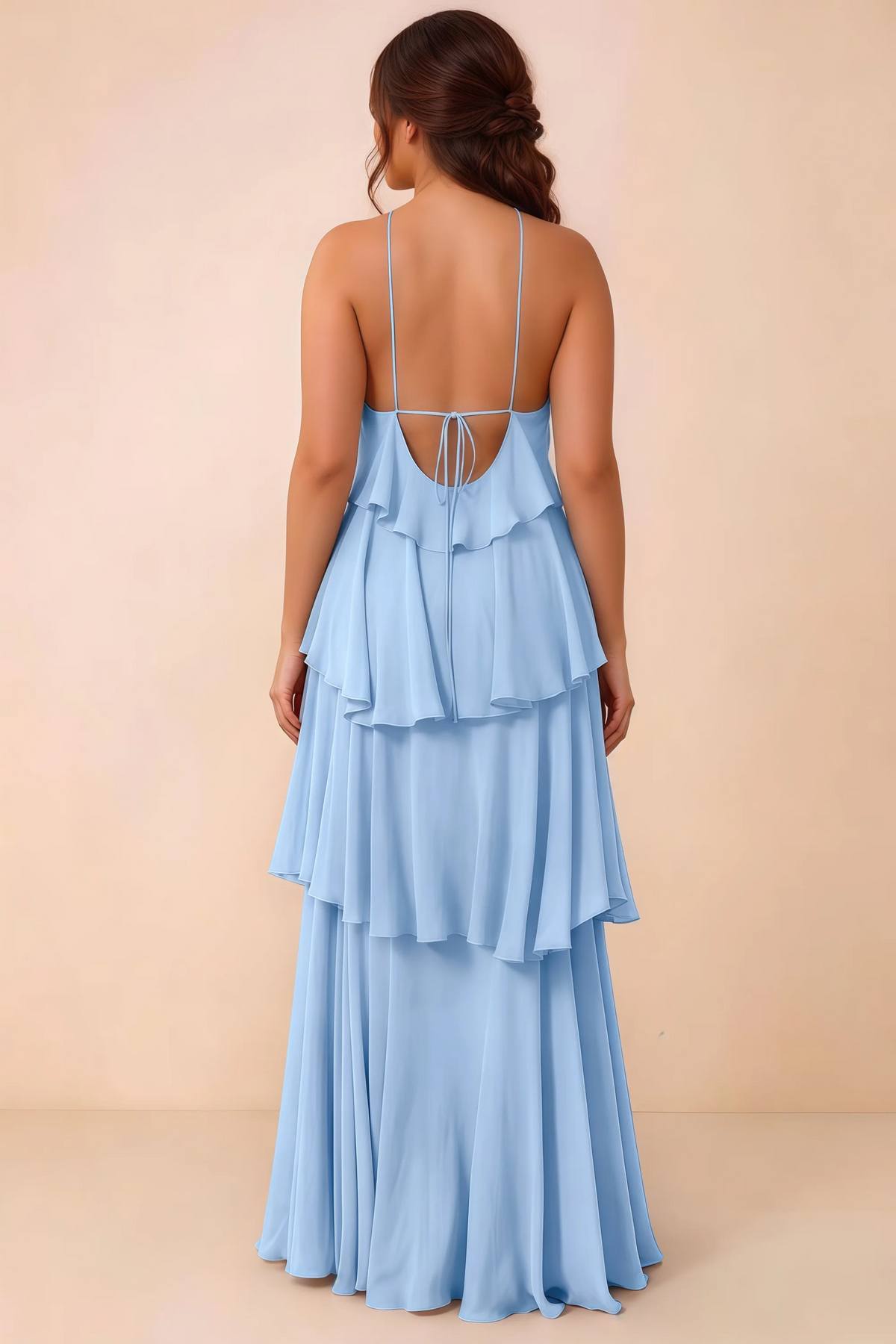 Rear studio view of Audrey ice blue tiered chiffon dress showing the low back and fine ties