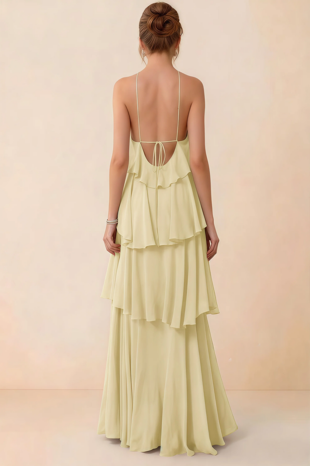 Back view of Audrey lemon ruffle maxi dress showing a low open back and fine tie straps