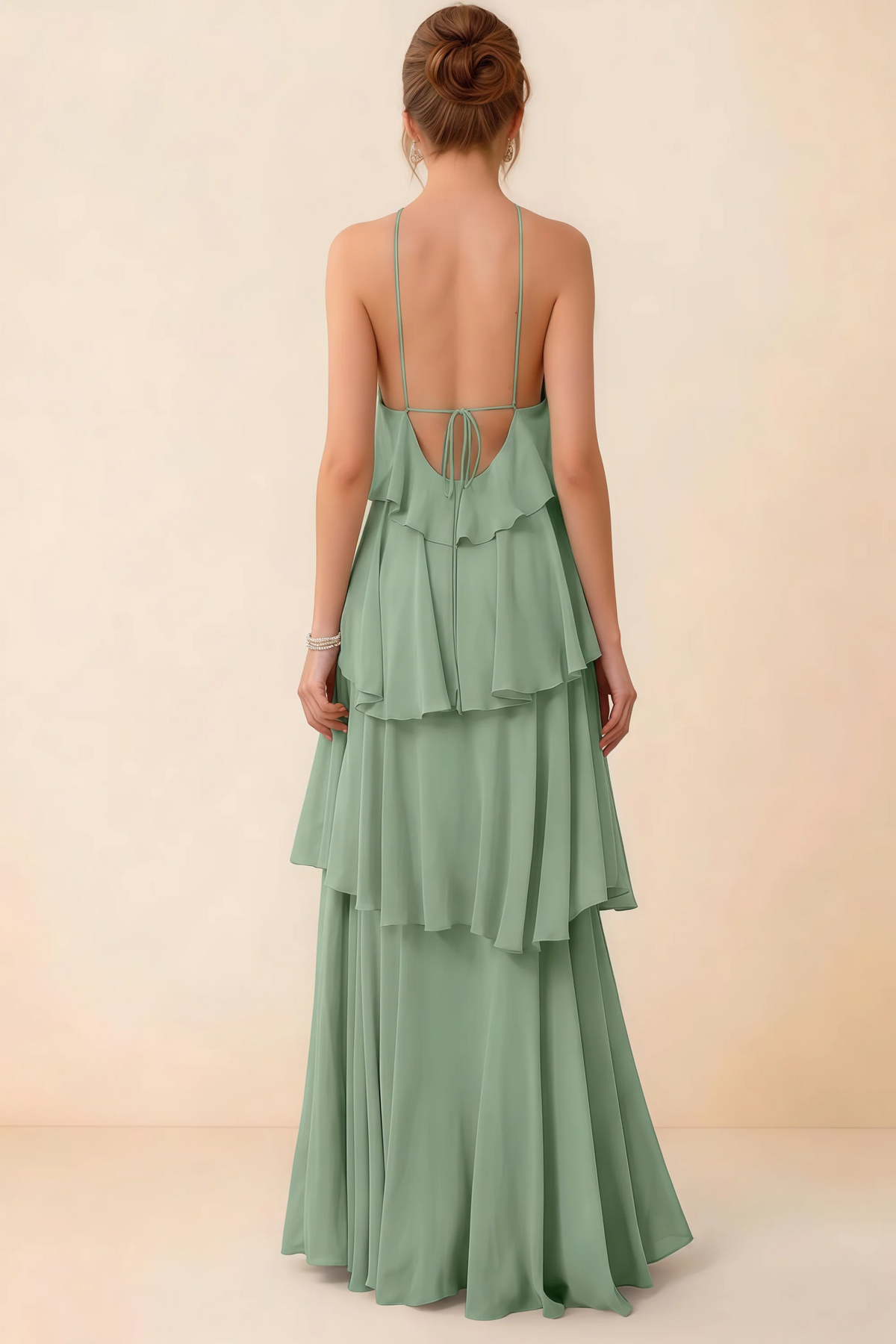 Back view of Audrey matcha green ruffle maxi dress showing a low open back and fine tie straps