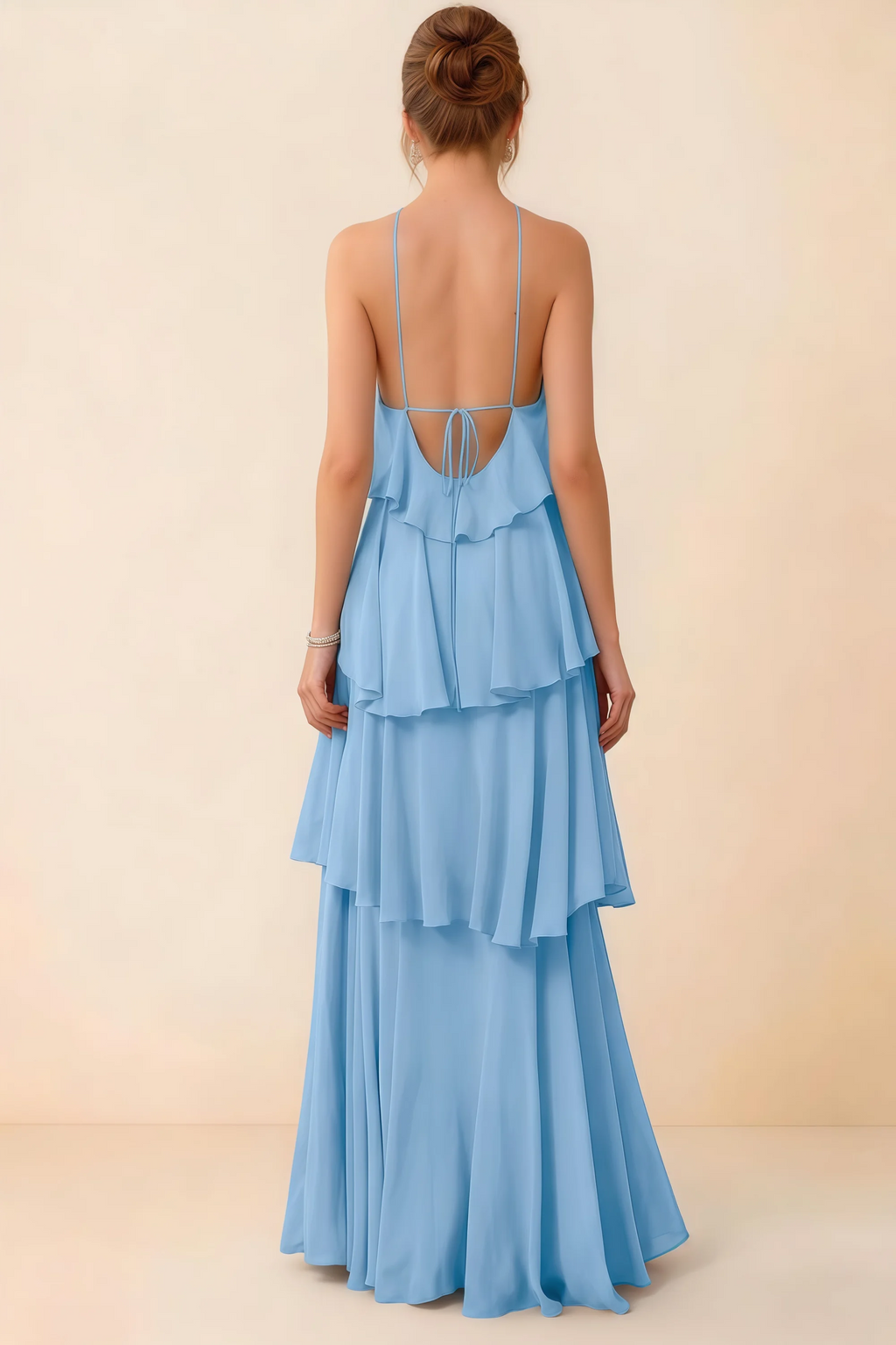 Back view of Audrey powder blue ruffle maxi dress showing a low open back and fine tie straps